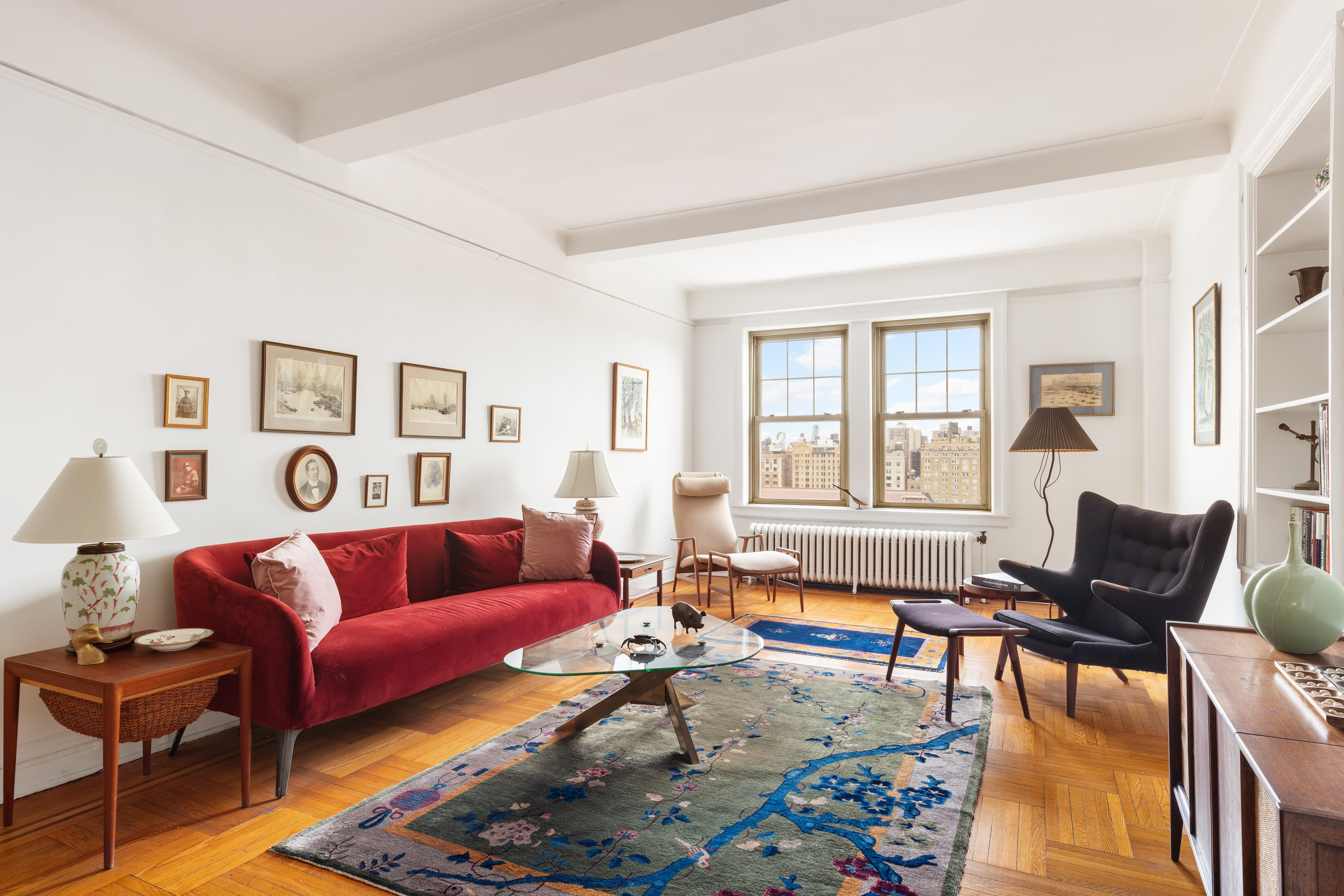 20 West 77th Street, Unit 15A Manhattan, NY 10024 - Photo 1 of 17 a living room with furniture wooden floor and a window