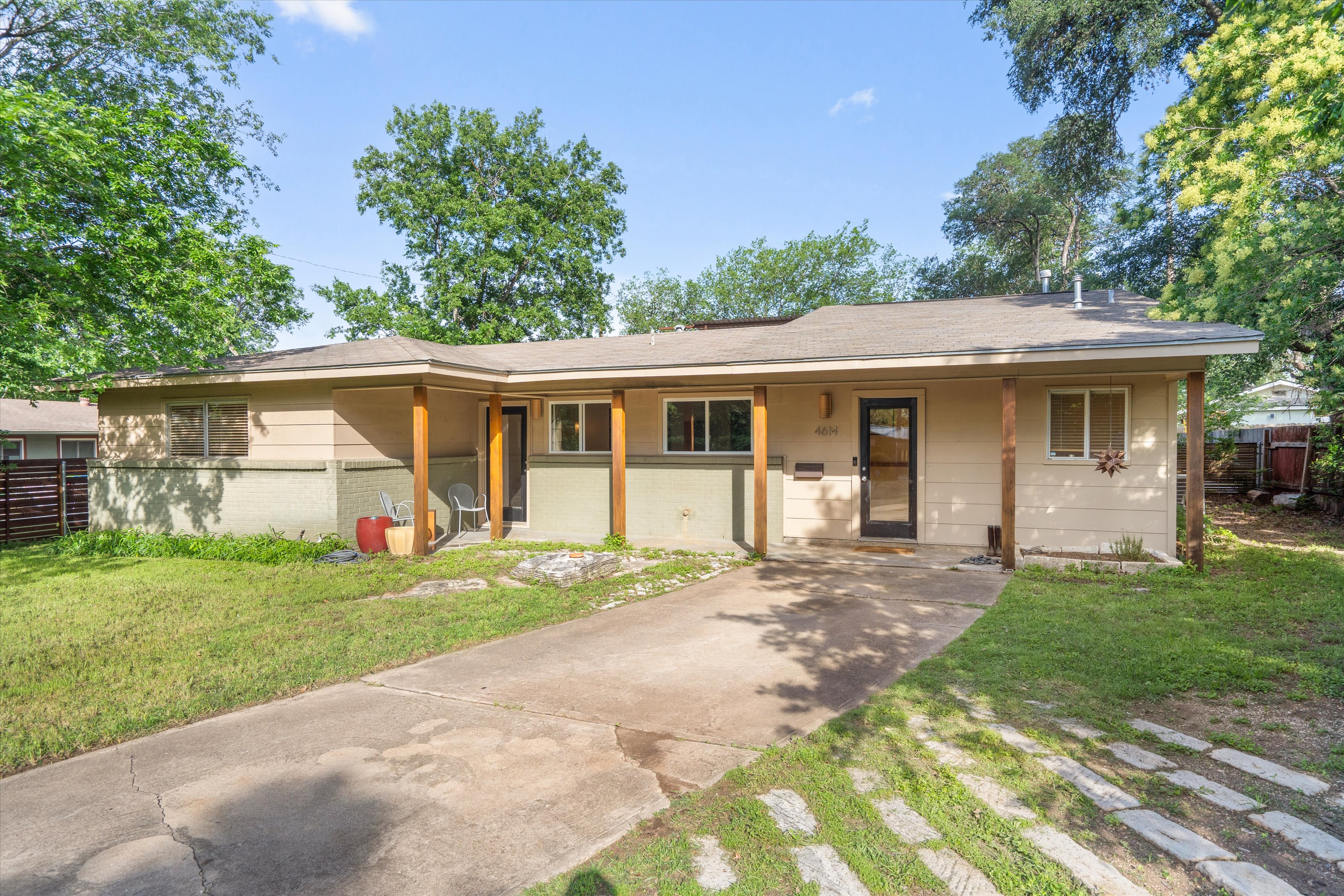 4614 Jinx Avenue Austin, TX 78745 - Photo 2 of 40 front view of a house with a yard