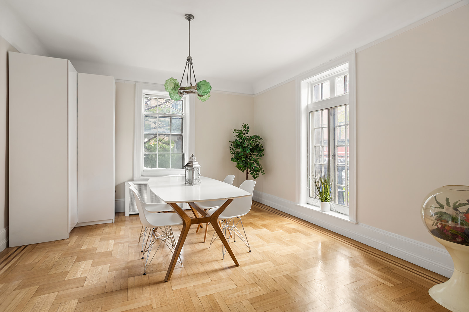 33-39 80th Street, Unit 2 Queens, NY 11372 - Photo 3 of 19 a dining room with furniture a chandelier and wooden floor