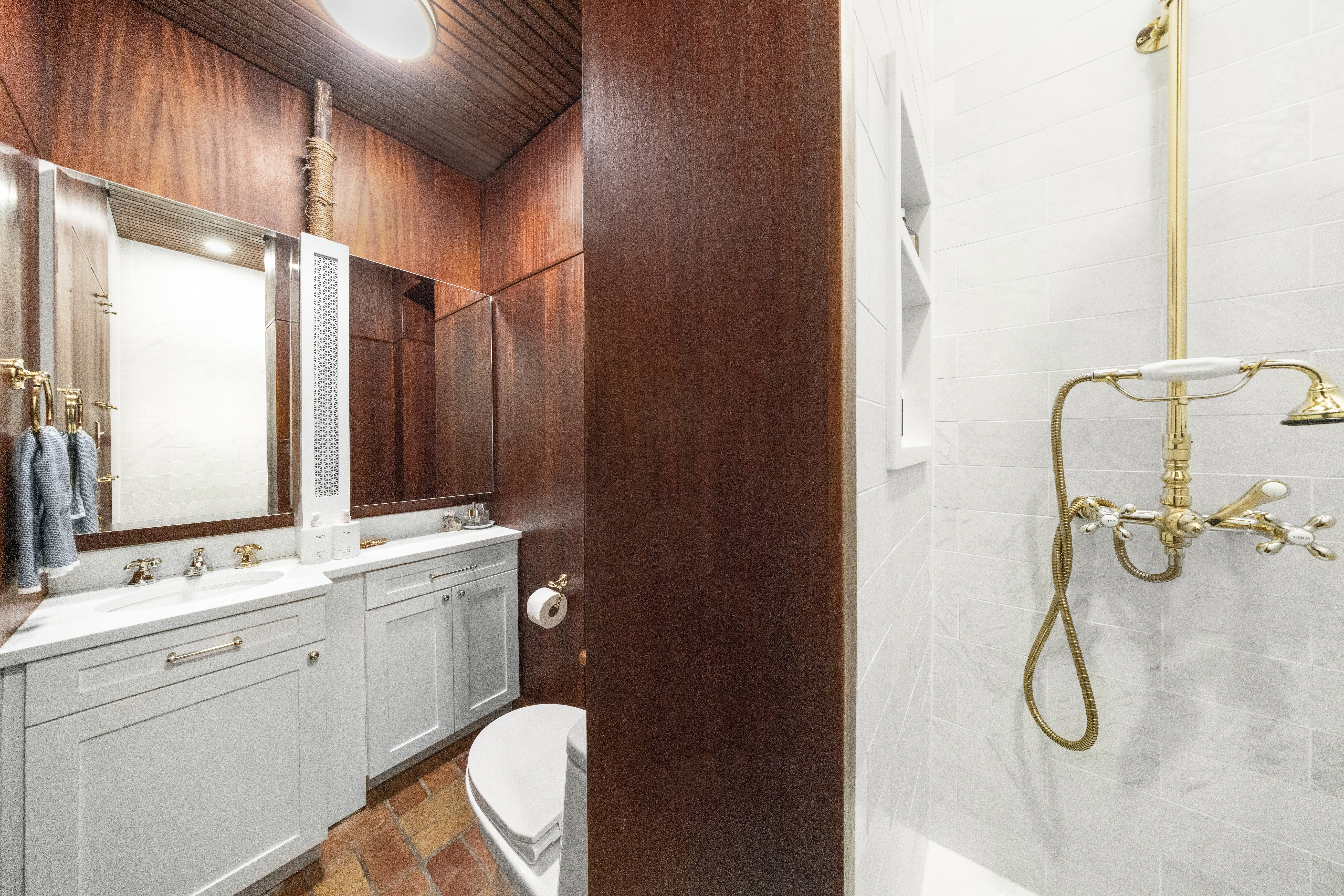 237 West 11th Street, Unit 2B Manhattan, NY 10014 - Photo 10 of 13 a bathroom with a double vanity sink toilet and shower