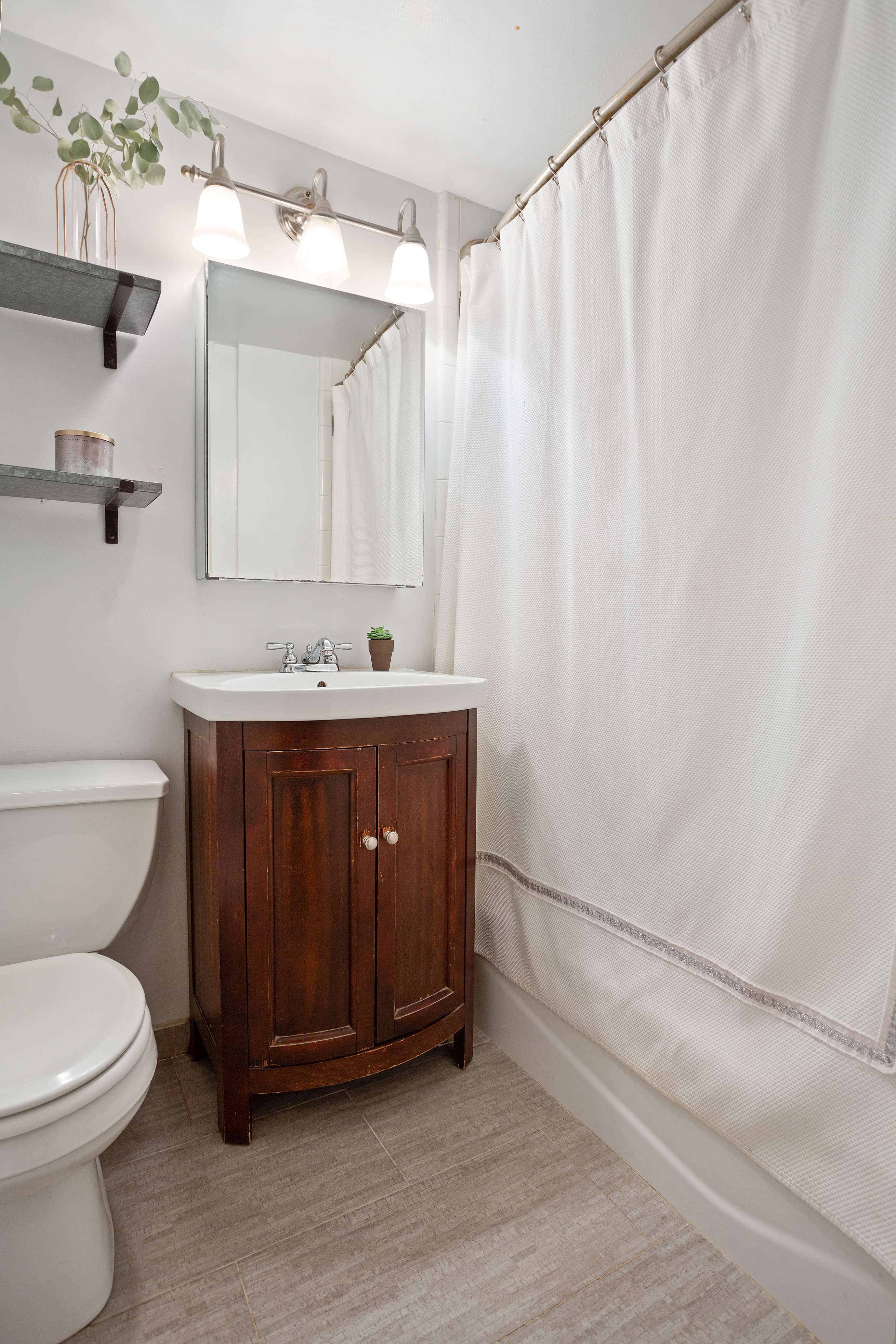 55 West 84th Street, Unit 5 Manhattan, NY 10024 - Photo 5 of 8 a bathroom with a sink a toilet and shower