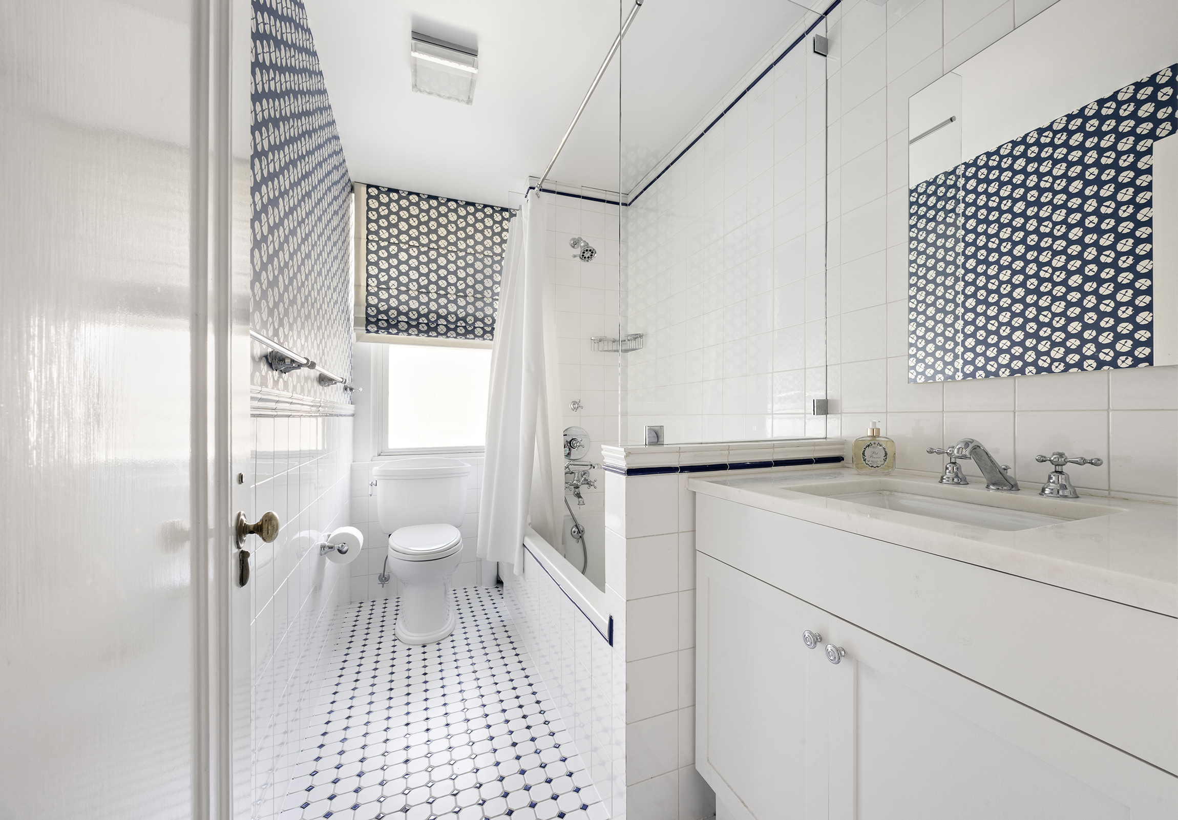 1035 Park Avenue, Unit 11B Manhattan, NY 10028 - Photo 11 of 13 a bathroom with a sink a toilet and a shower