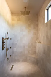 a bedroom with a bed and glass window