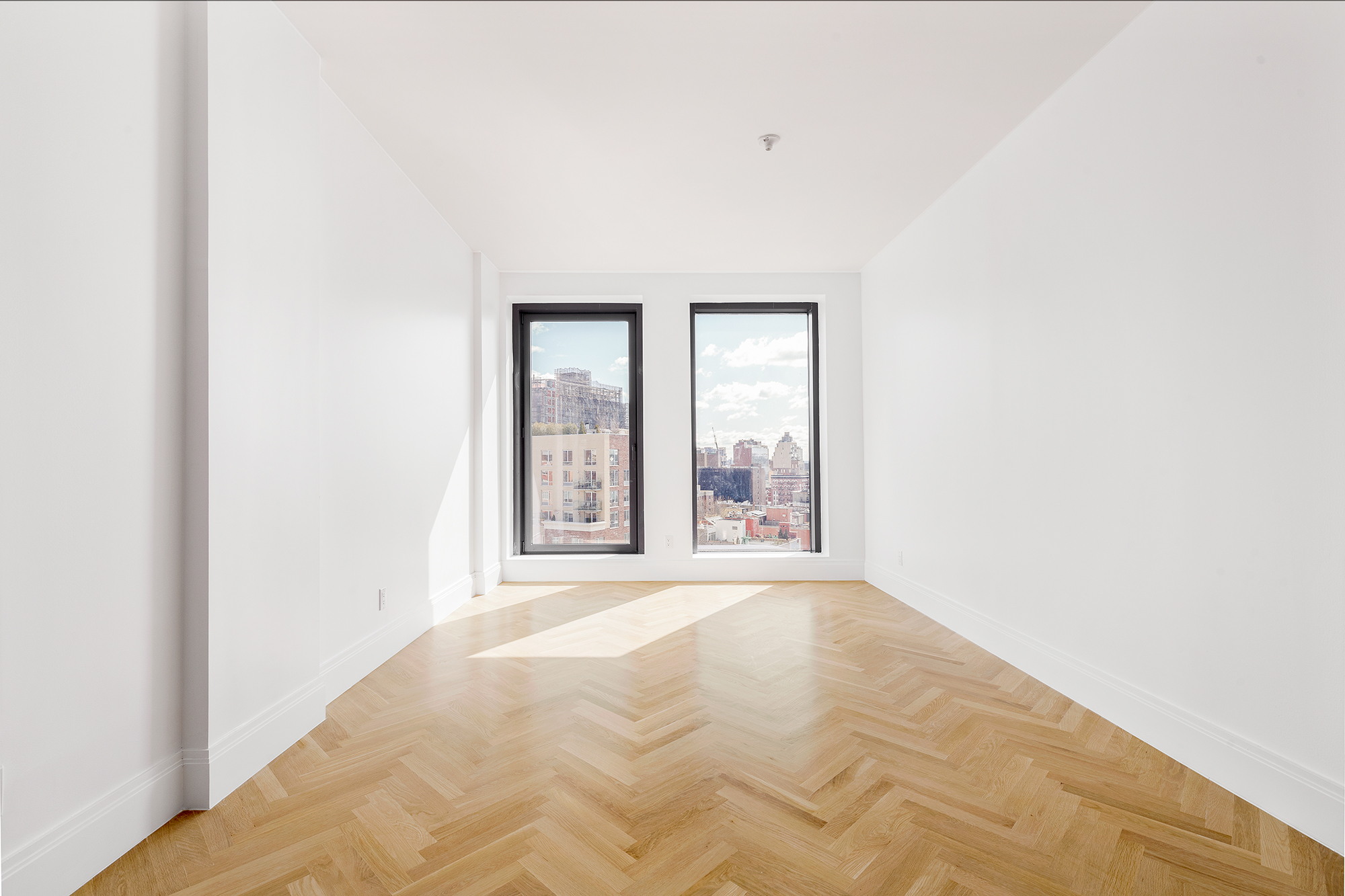 300 West 122nd Street, Unit 12C Manhattan, NY 10027 - Photo 5 of 11 a view of an empty room with a window