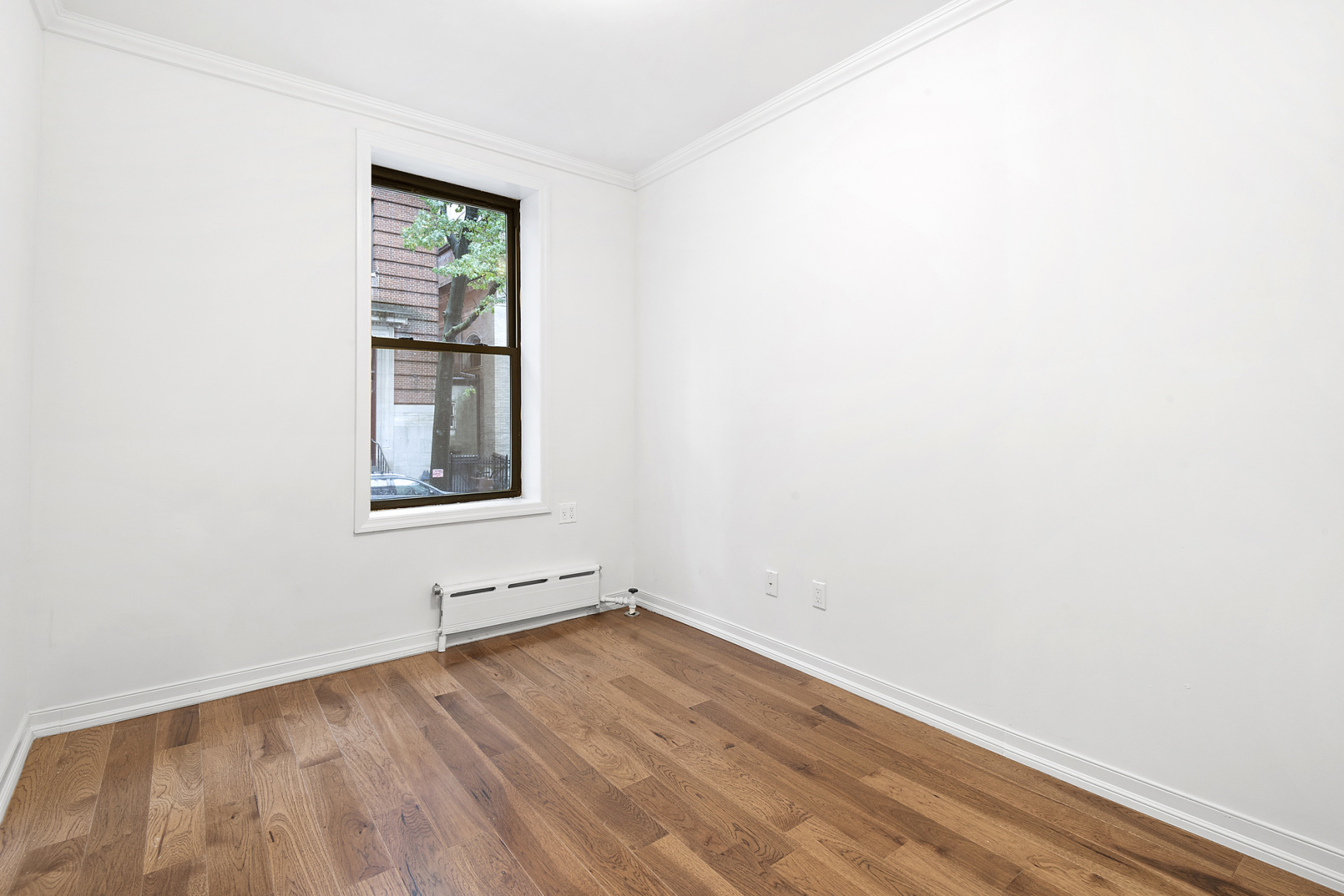 573 6th Street, Unit 1 Brooklyn, NY 11215 - Photo 5 of 10 wooden floor in a empty room