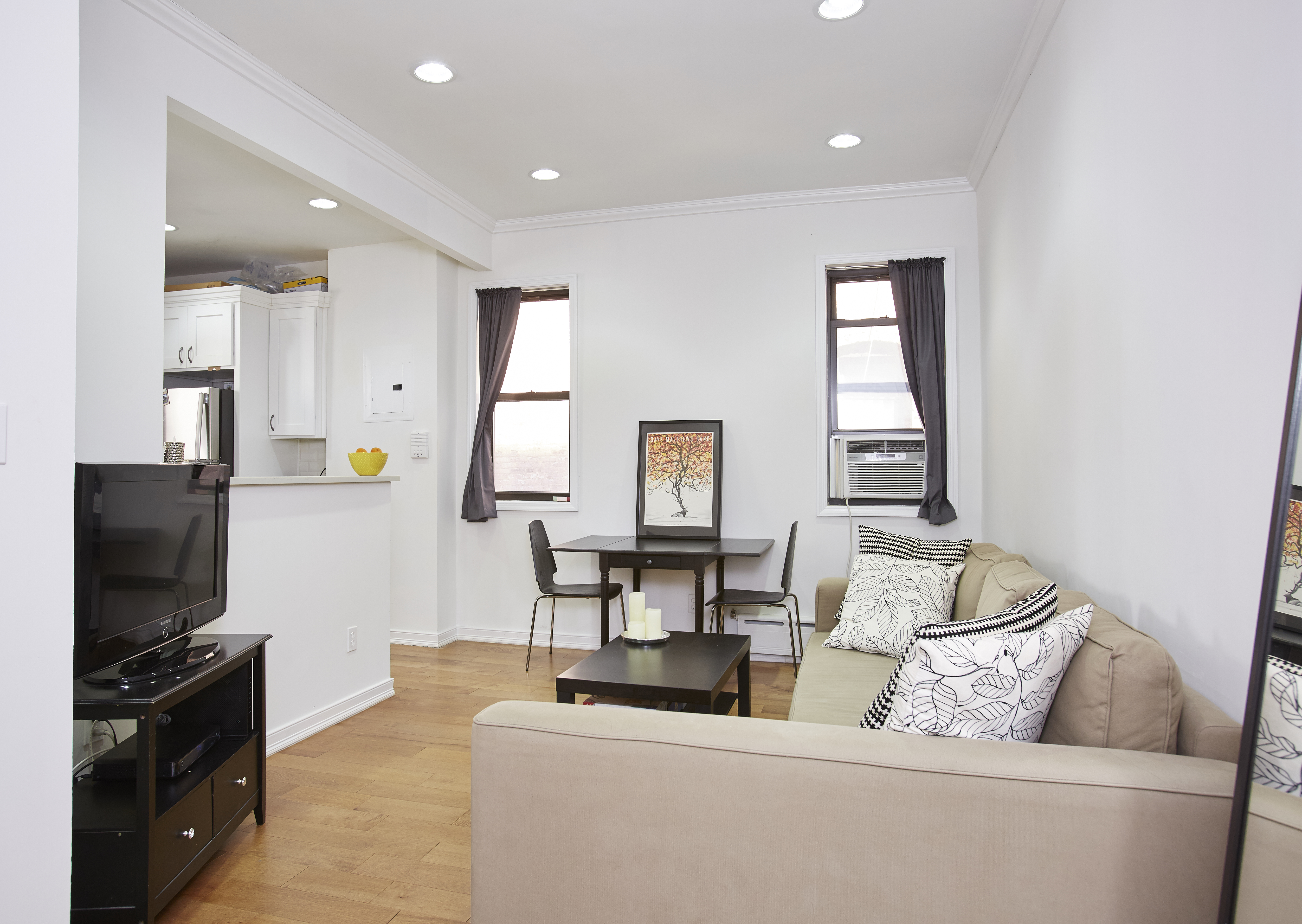 567 6th Street, Unit 7 Brooklyn, NY 11215 - Photo 3 of 9 a living room with furniture and a flat screen tv