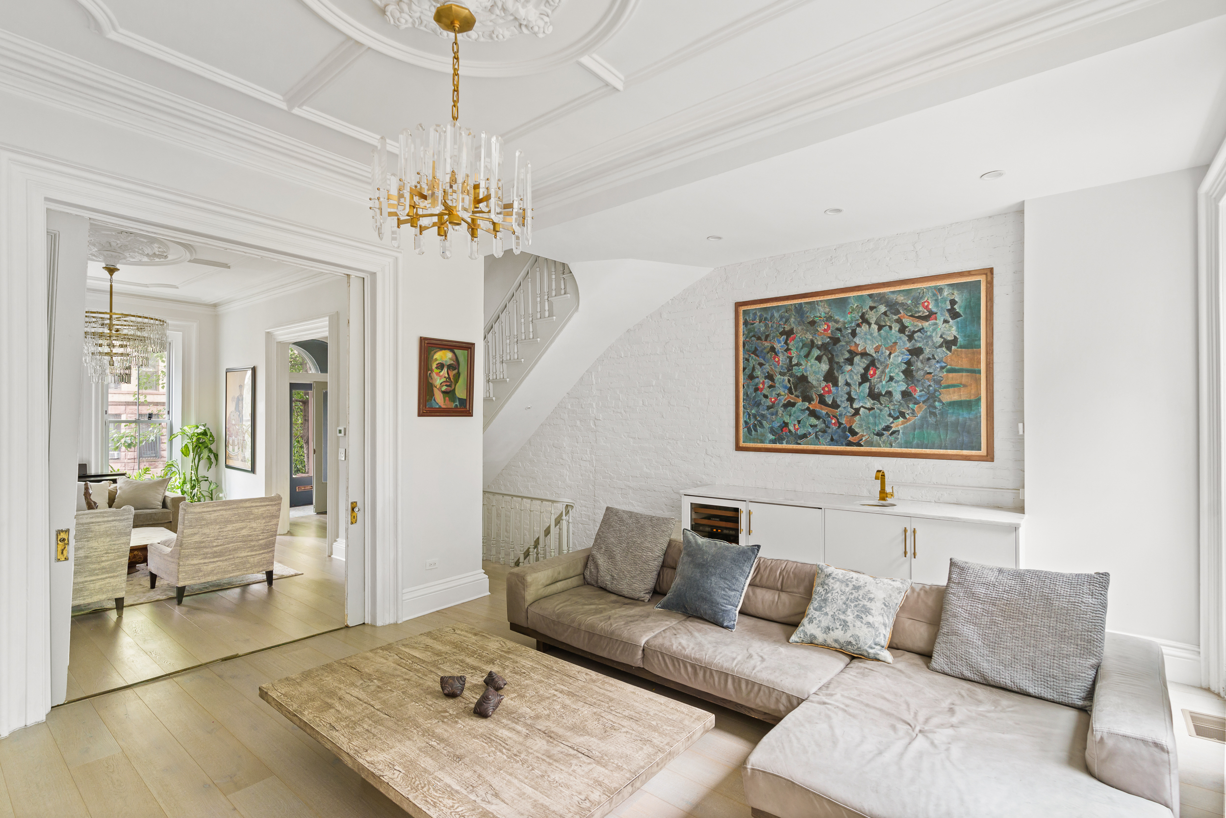 265 6th Avenue Brooklyn, NY 11215 - Photo 2 of 24 a living room with furniture a chandelier and a rug