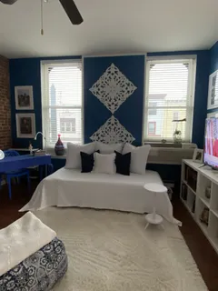 a living room with furniture and a large window
