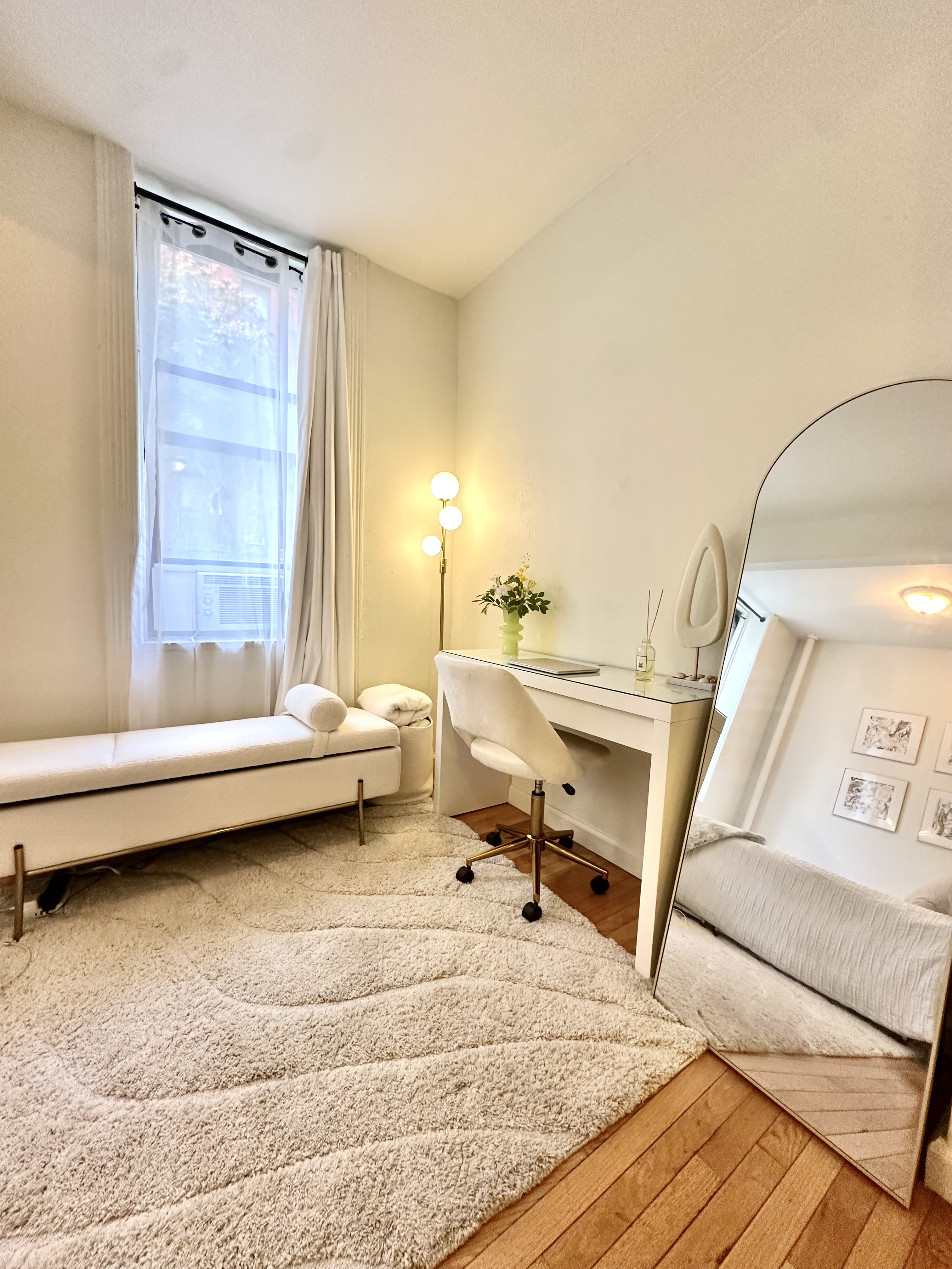 110 Thompson Street, Unit 1A Manhattan, NY 10012 - Photo 2 of 4 a living room with a couch and a table