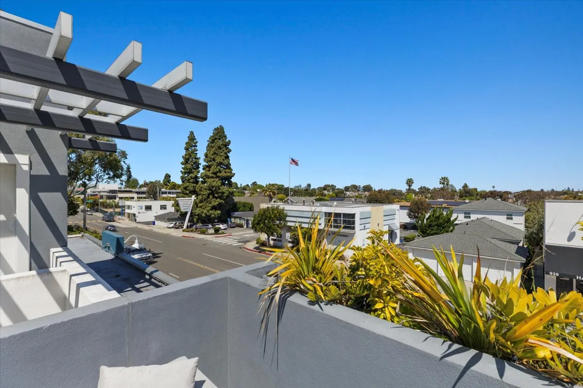 a view of a swimming pool with outdoor seating space