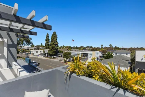 a view of a swimming pool with outdoor seating space