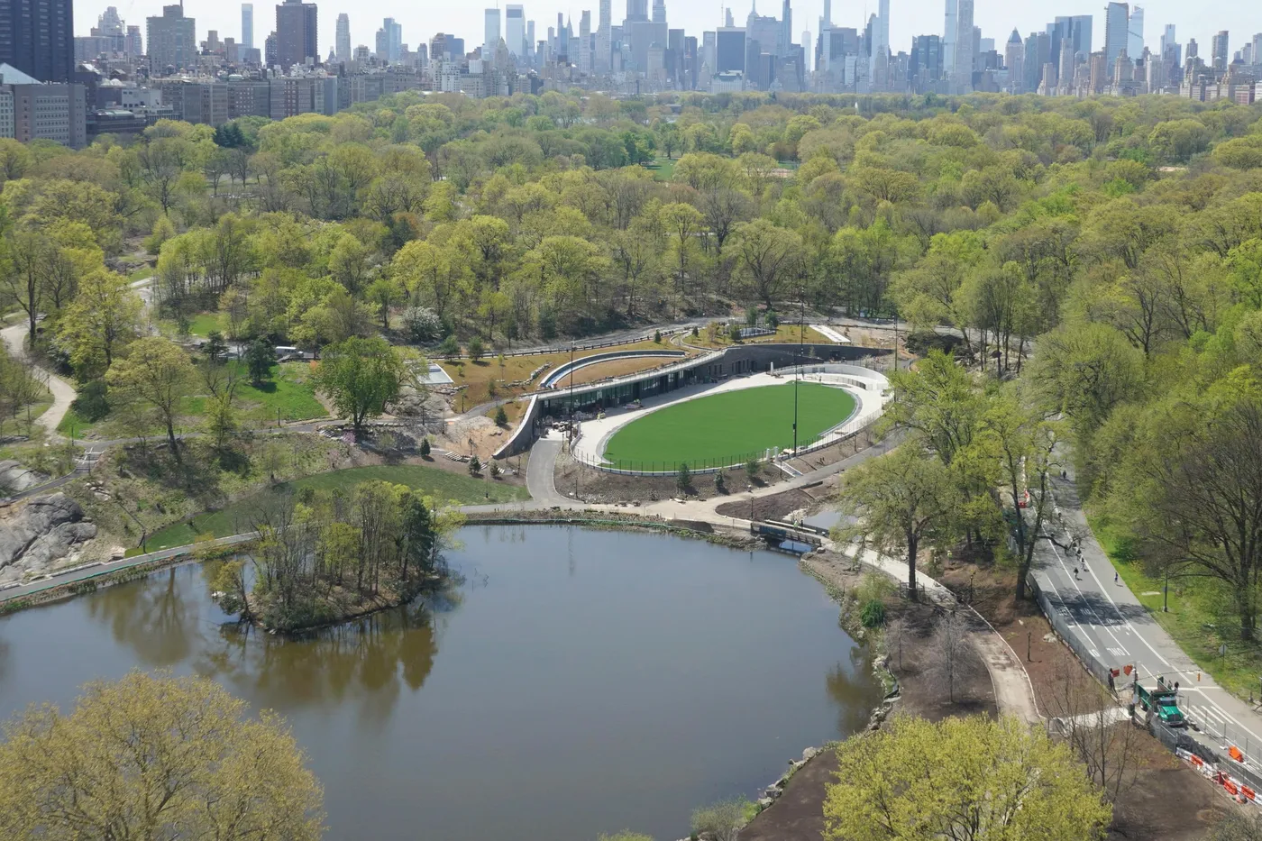 1878 Adam Clayton Powell Jr Boulevard, Unit 52 Manhattan, NY 10026 - Photo 11 of 13 a view of a house with a yard and a large pool