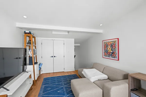 a living room with furniture and a rug