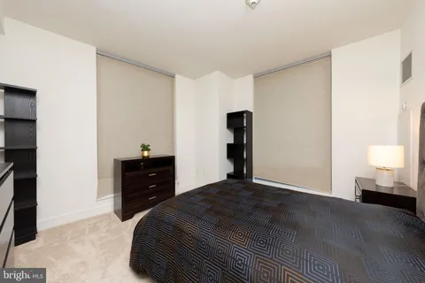 a bedroom with a bed and a closet
