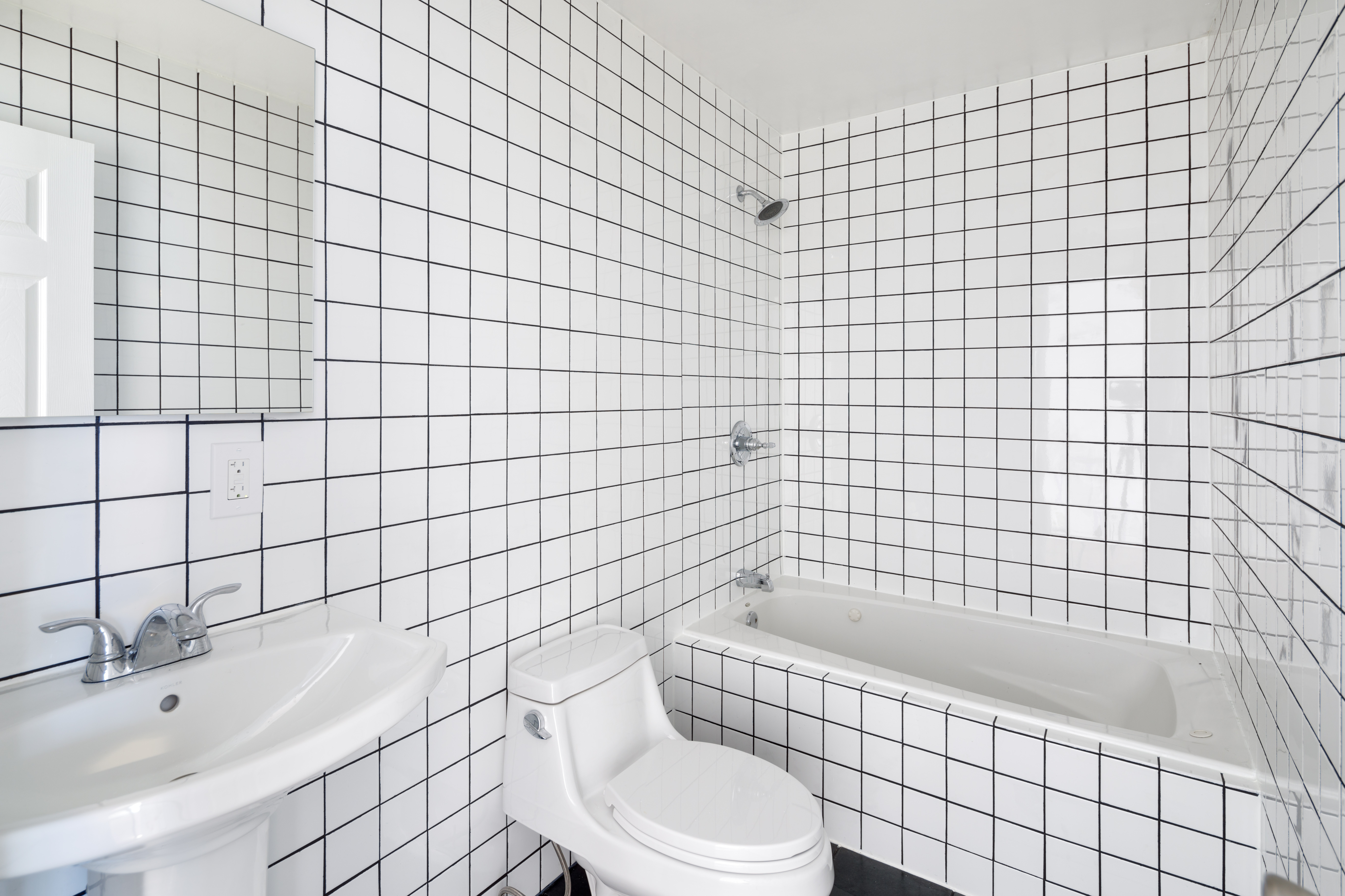 174 Patchen Avenue Brooklyn, NY 11221 - Photo 8 of 12 a bathroom with a bathtub and toilet