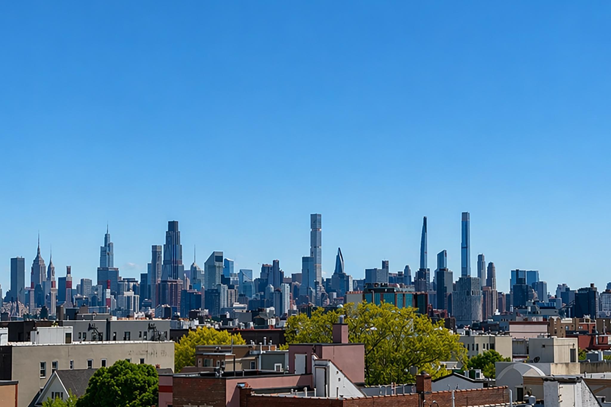 24-39 38th Street, Unit B10B9 Queens, NY 11103 - Photo 19 of 20 a view of a city with tall buildings