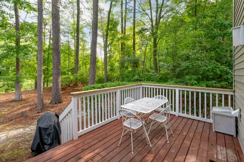 a view of balcony with furniture and wooden deck