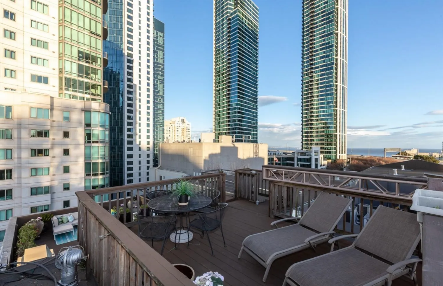 a view of balcony with a couple of chairs