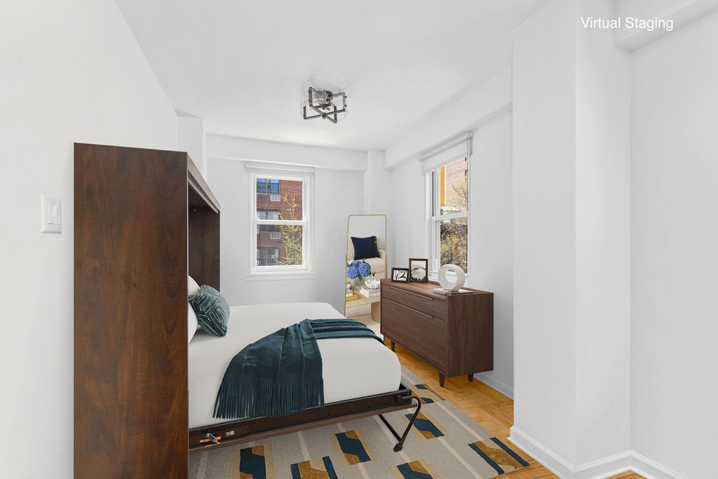 101 West 12th Street, Unit 5V Manhattan, NY 10011 - Photo 6 of 26 a bedroom with furniture and a window