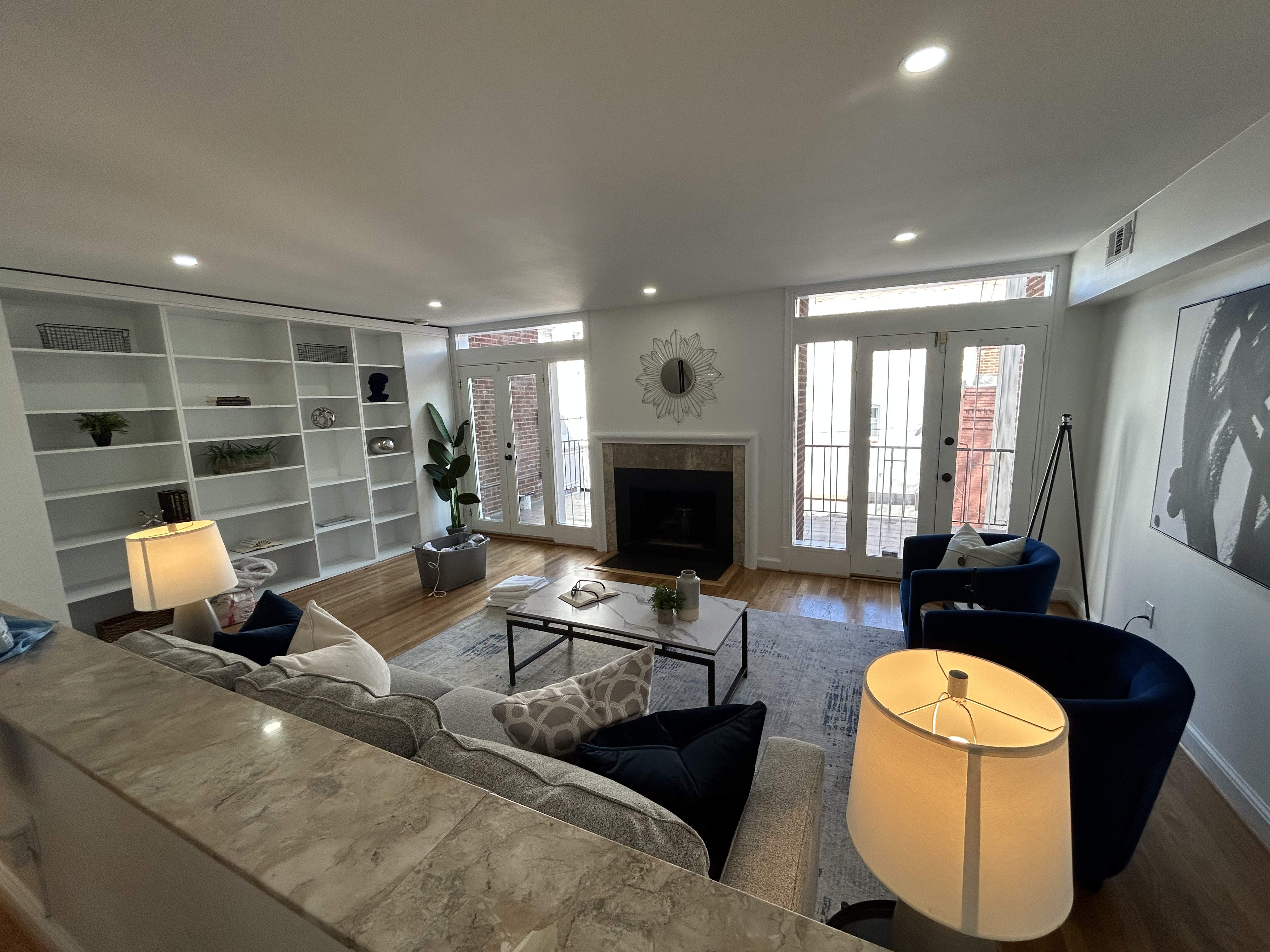 1823 16th Street Northwest, Unit 2 Washington, DC 20009 - Photo 6 of 19 a living room with furniture a rug a fireplace and a large window