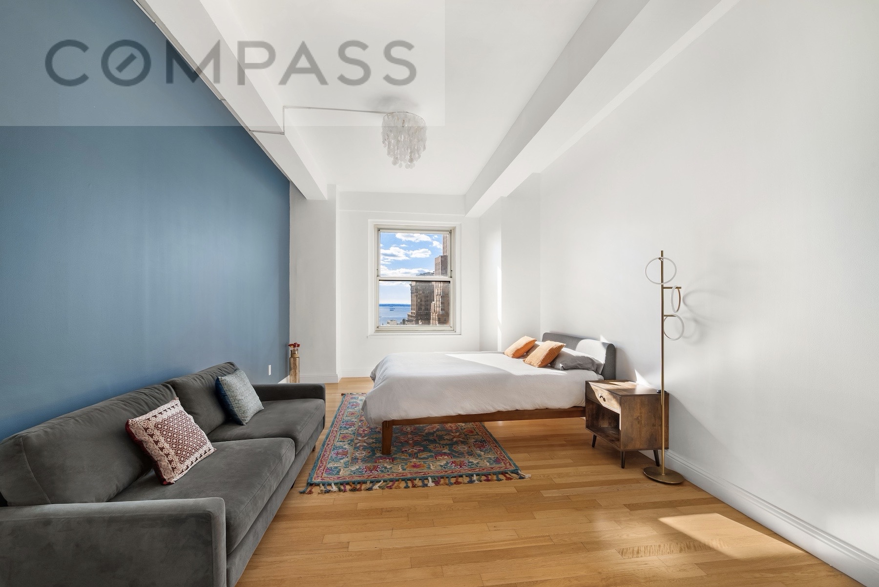 a bedroom with furniture and a window