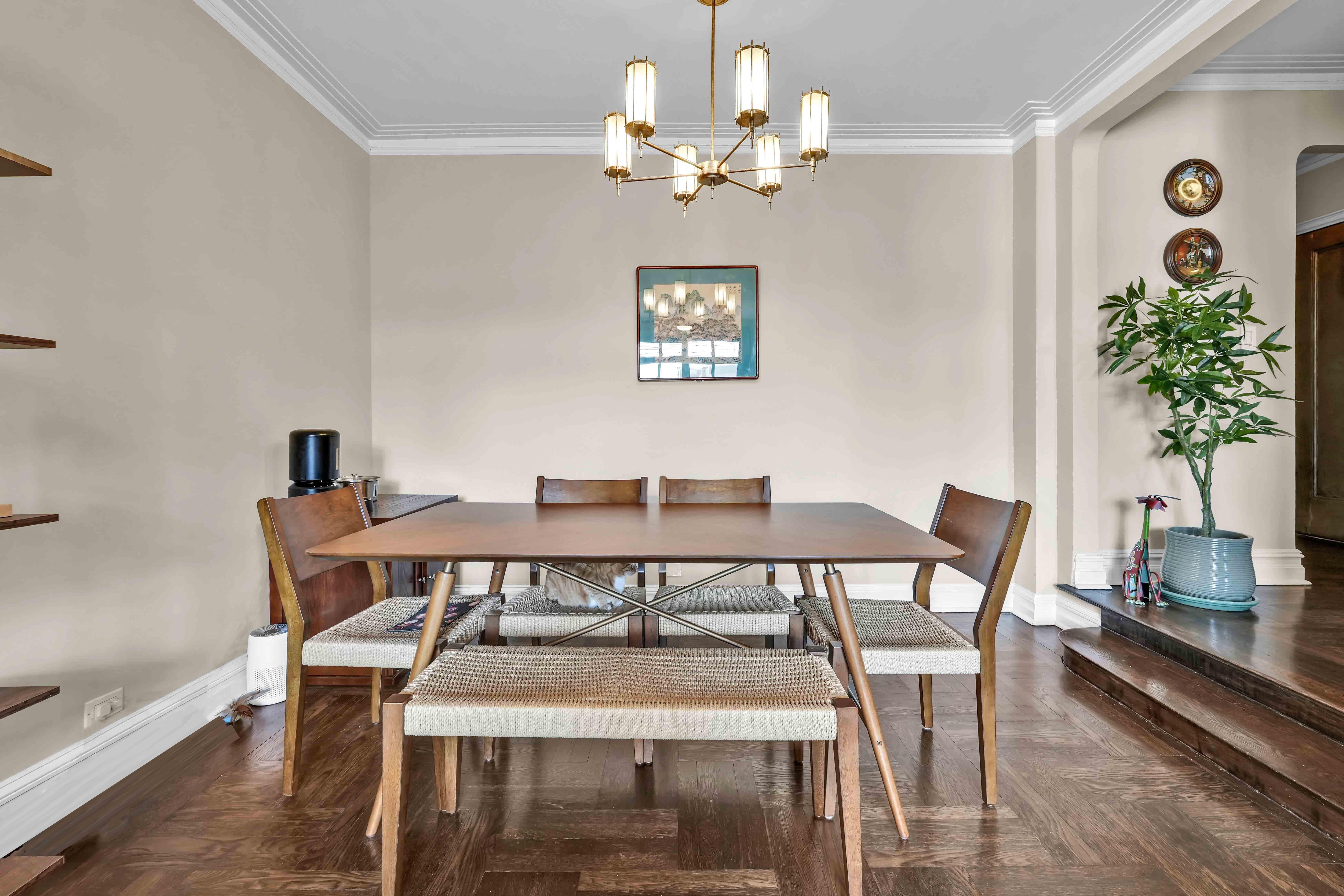 255 West 23rd Street, Unit 5GW Manhattan, NY 10011 - Photo 9 of 35 a view of a dining room with furniture and a chandelier