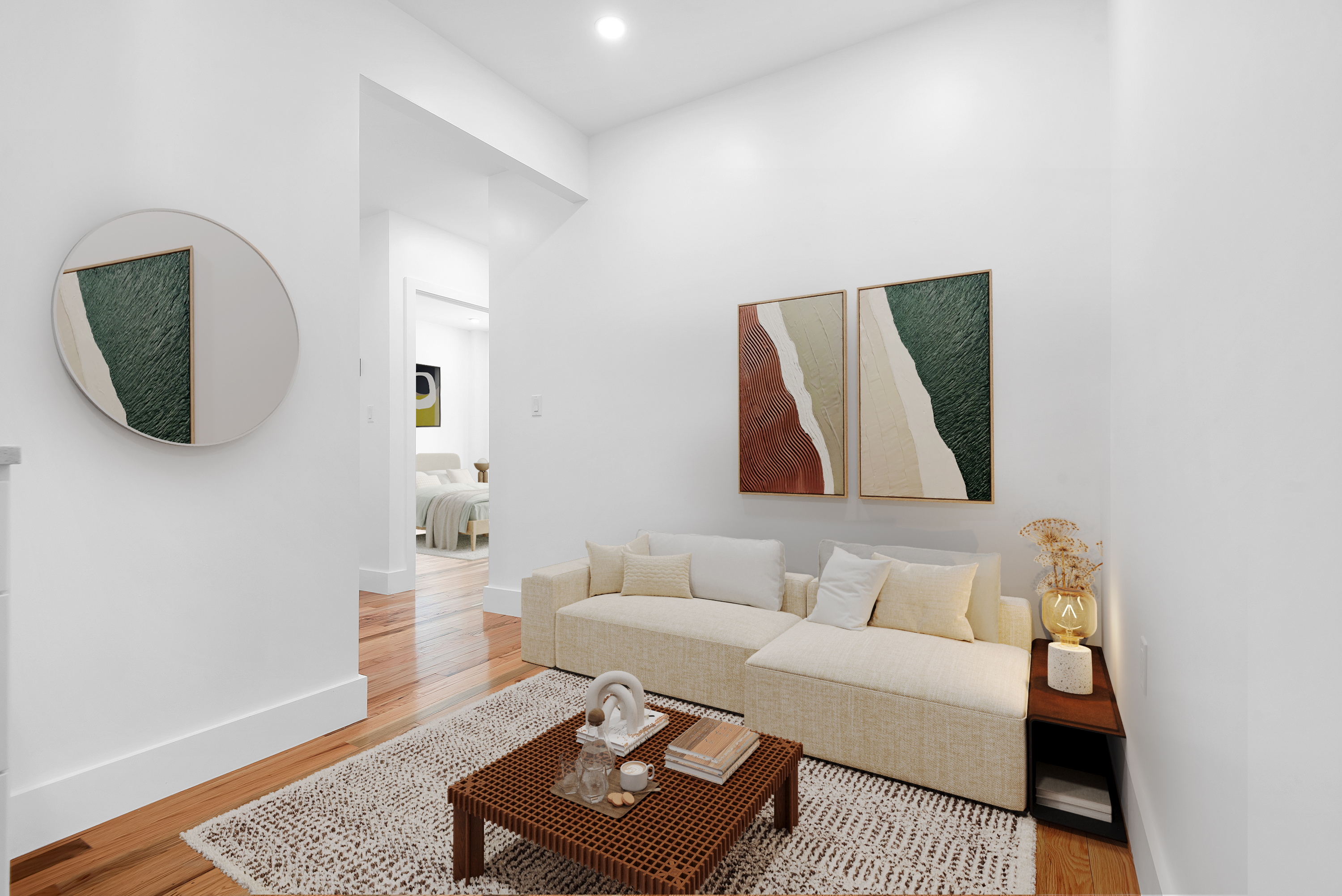 174 7th Avenue, Unit 3E Manhattan, NY 10011 - Photo 2 of 6 a living room with furniture and a wooden floor