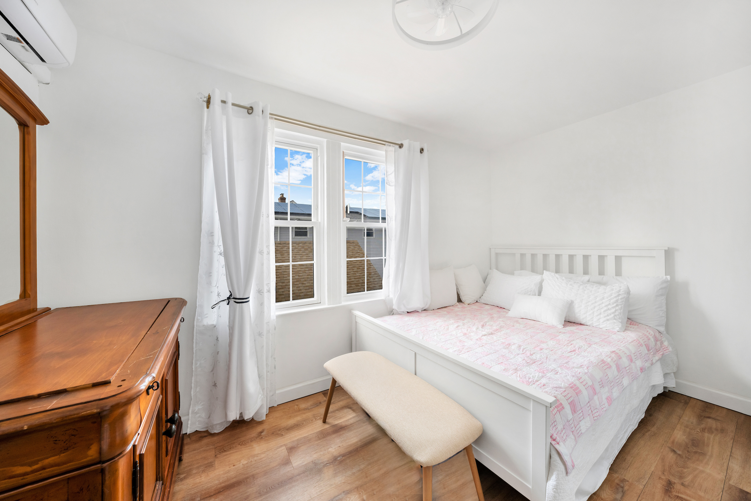 132-11 107th Avenue Queens, NY 11419 - Photo 7 of 14 a bedroom with a bed and wooden floor