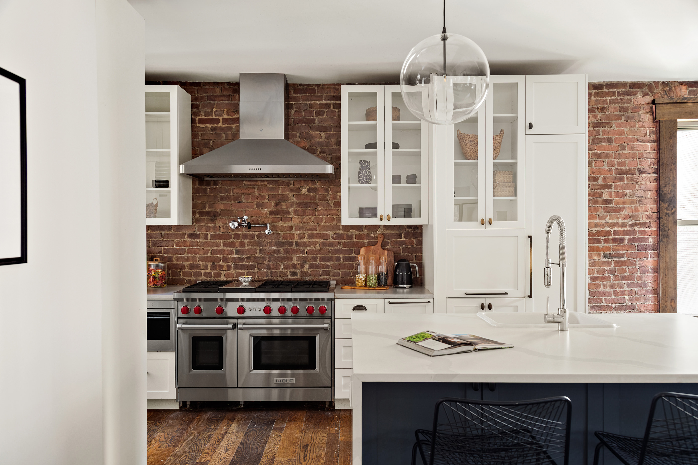 311 West 97th Street, Unit 5N Manhattan, NY 10025 - Photo 3 of 16 a kitchen with a stove a sink and cabinets