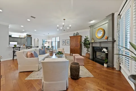 a living room with fireplace furniture and a fireplace