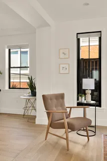 a workspace with furniture and a window