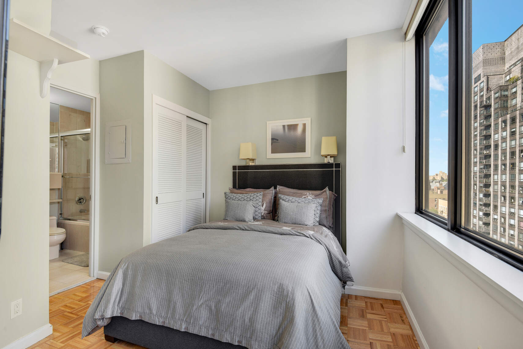 455 East 86th Street, Unit 8D Manhattan, NY 10028 - Photo 4 of 13 a bedroom with a bed and a window