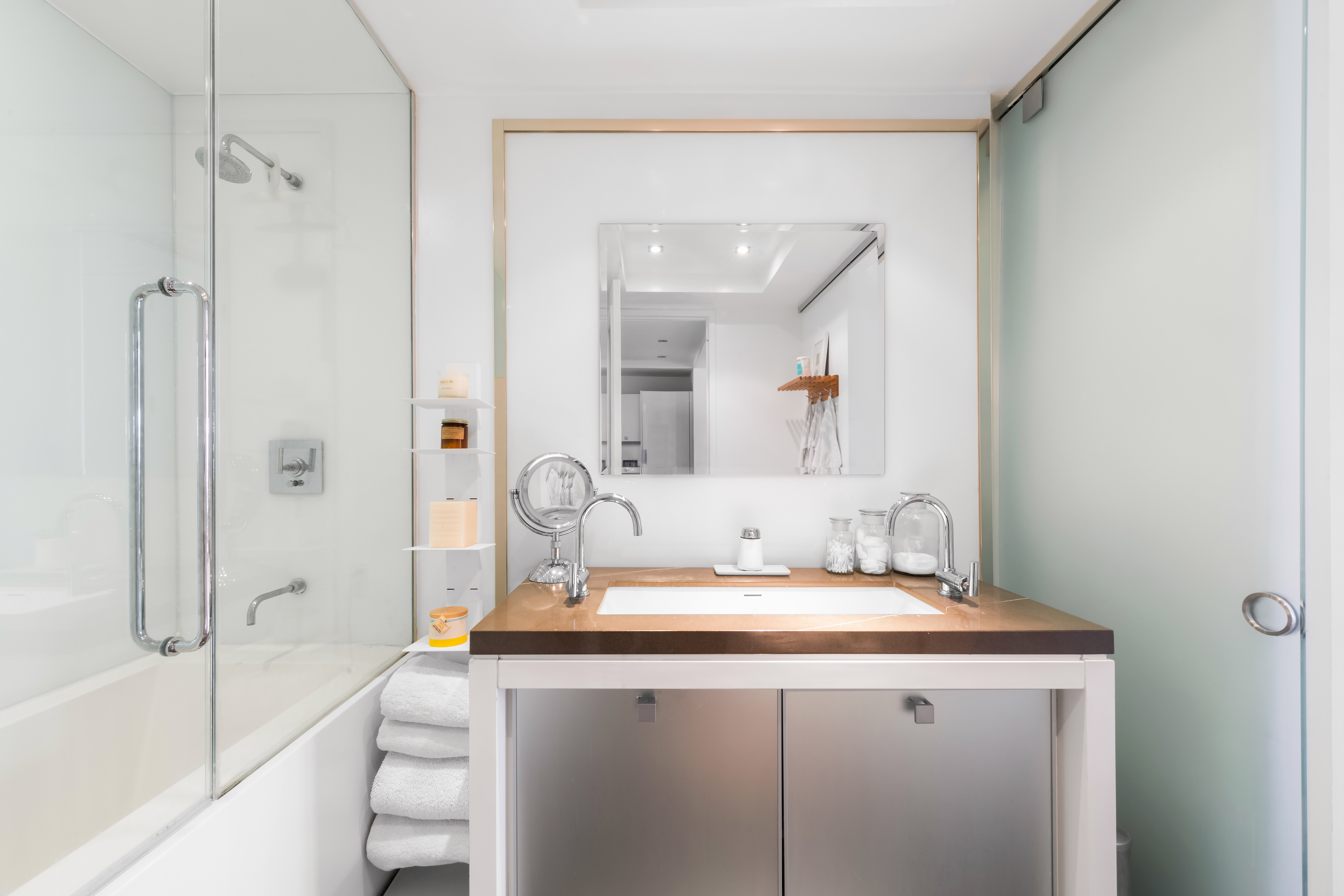 444 West 19th Street, Unit 403 Manhattan, NY 10011 - Photo 5 of 6 a bathroom with a sink and a mirror