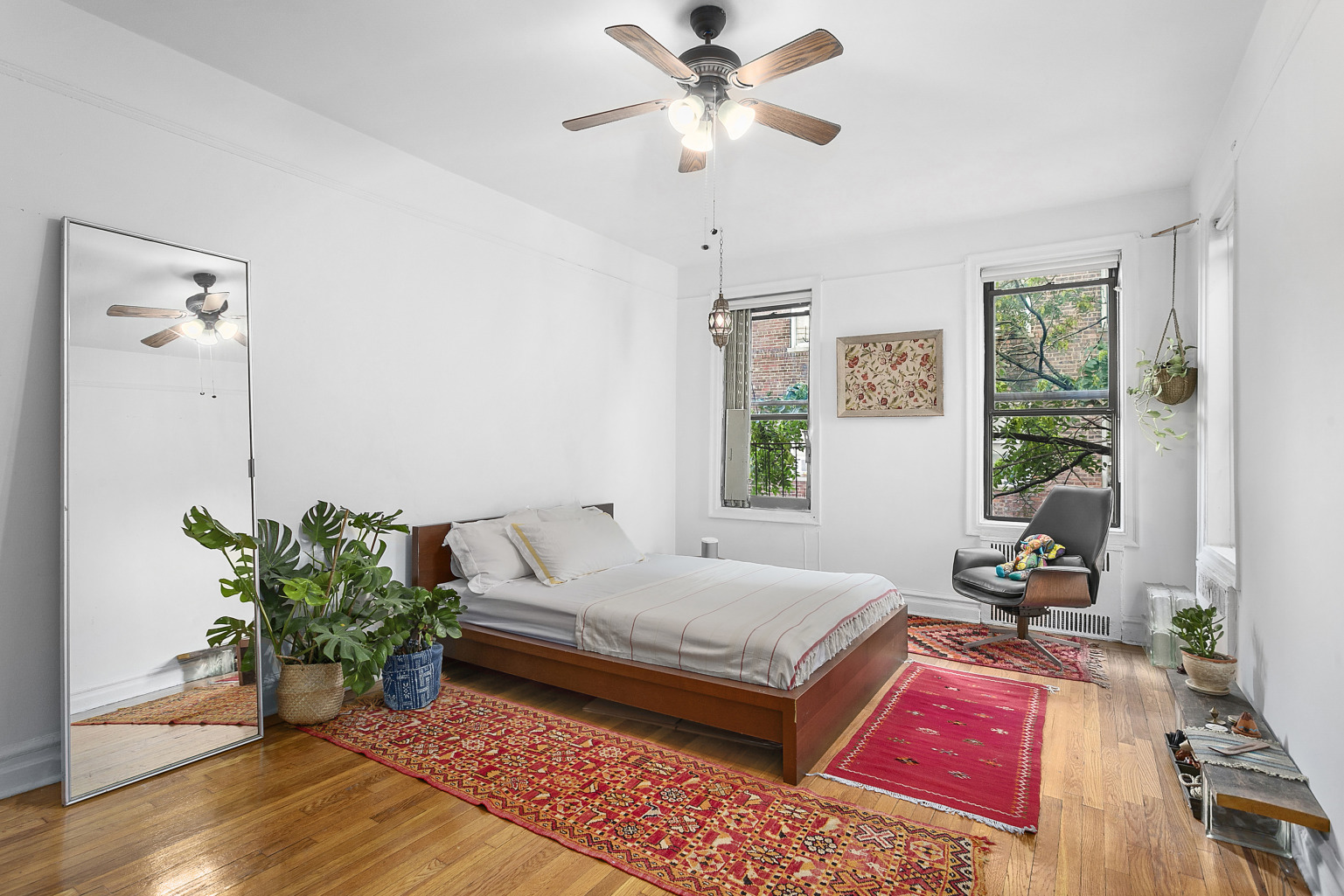 70 Lenox Road, Unit C4 Brooklyn, NY 11226 - Photo 5 of 7 a bedroom with a bed chandelier and a window