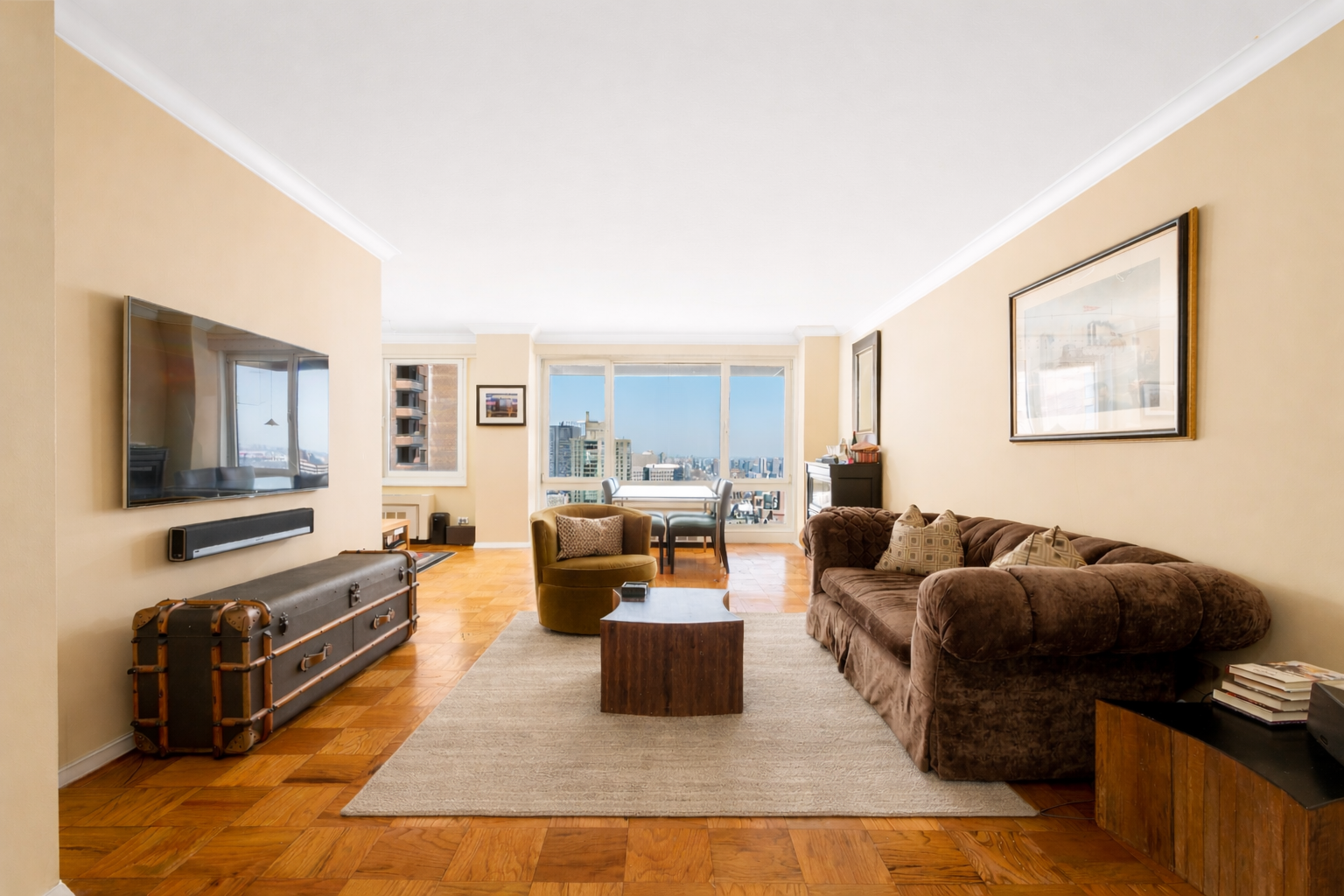 50 East 89th Street, Unit 31C Manhattan, NY 10128 - Photo 1 of 18 a living room with furniture and a flat screen tv