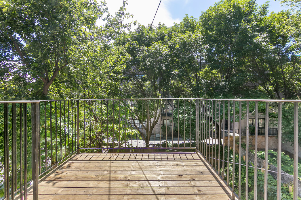 730 Quincy Street, Unit 2 Brooklyn, NY 11221 - Photo 9 of 11 a view of a balcony with wooden floor