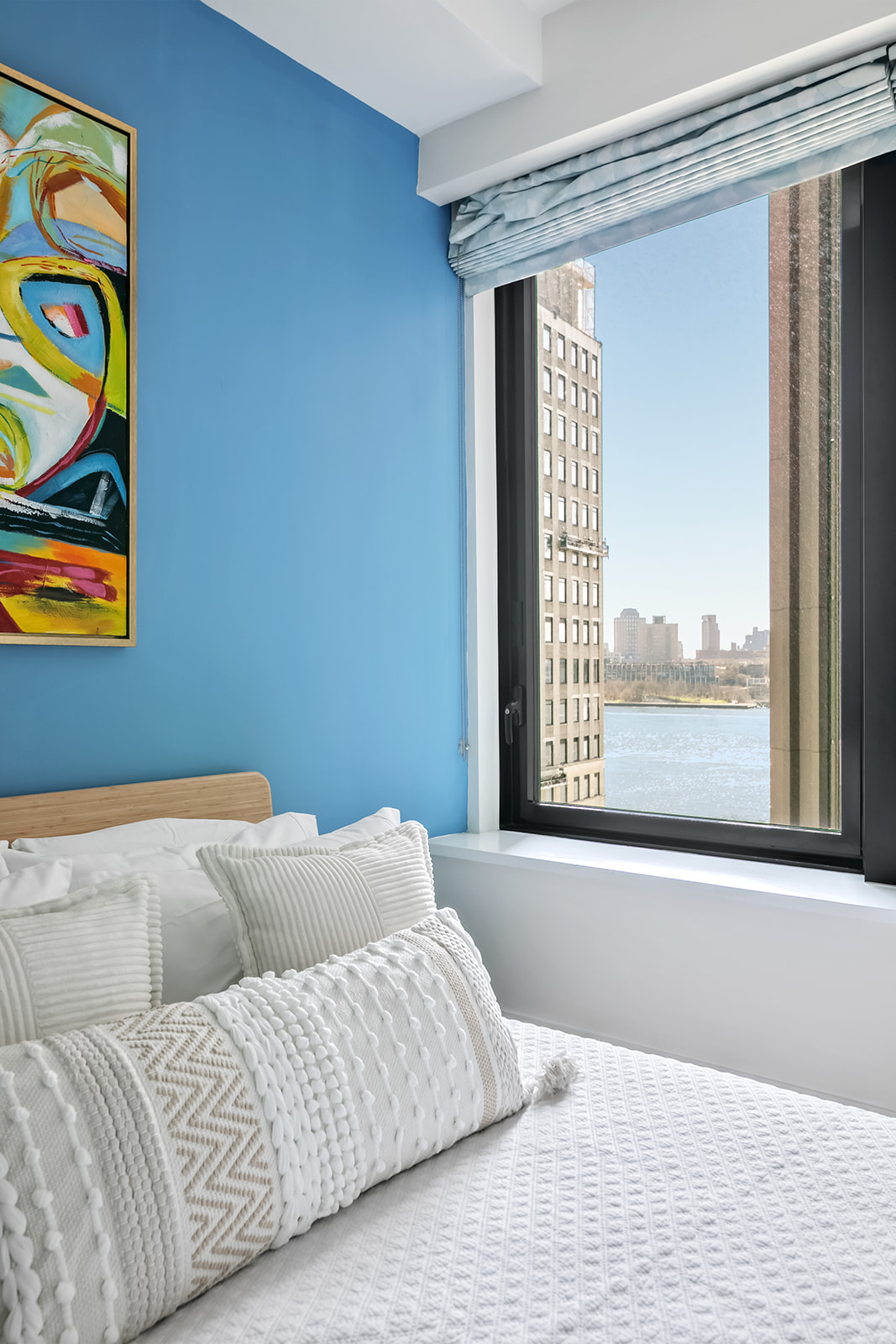 101 Wall Street, Unit 10C Manhattan, NY 10005 - Photo 6 of 15 a bedroom with a bed and a window