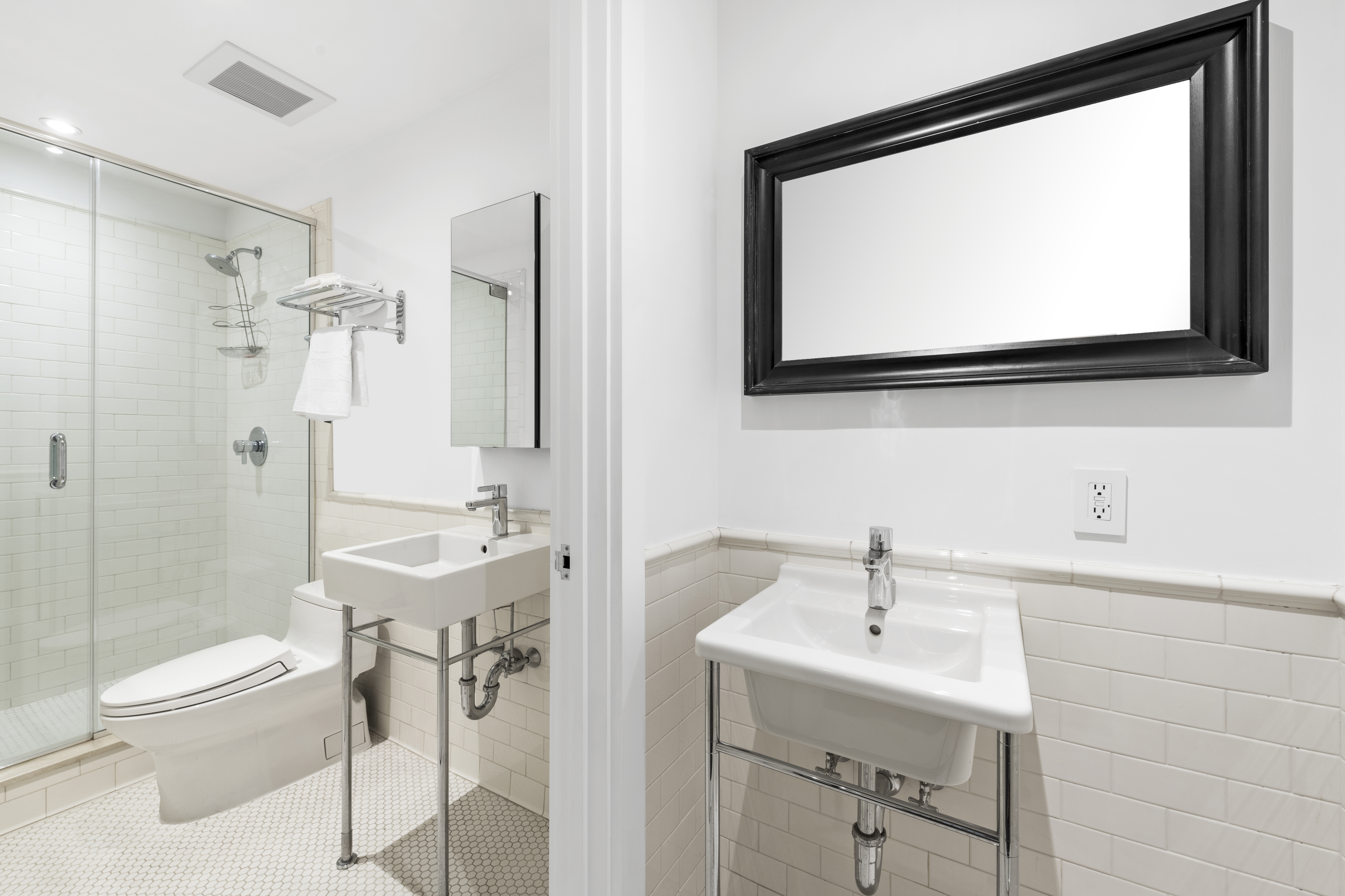 60 Collister Street, Unit 1B Manhattan, NY 10013 - Photo 16 of 20 a bathroom with a sink a toilet and shower