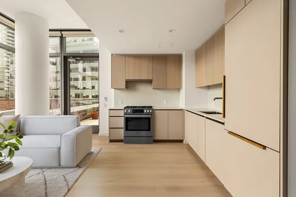 a kitchen with stainless steel appliances a refrigerator sink and cabinets