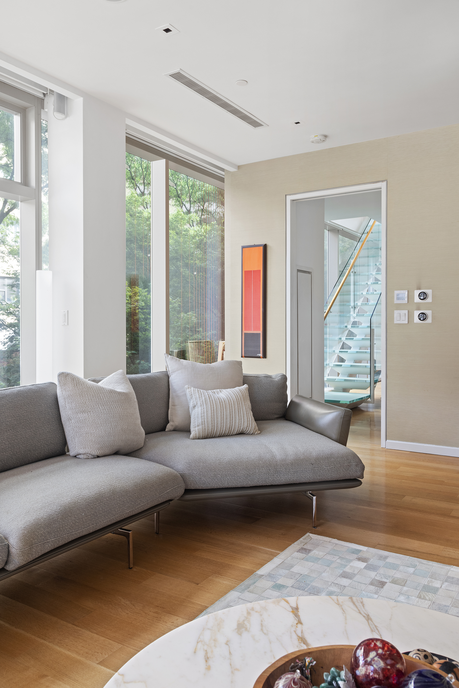 1055 Park Avenue, Unit 1 Manhattan, NY 10028 - Photo 4 of 19 a living room with furniture and a large window