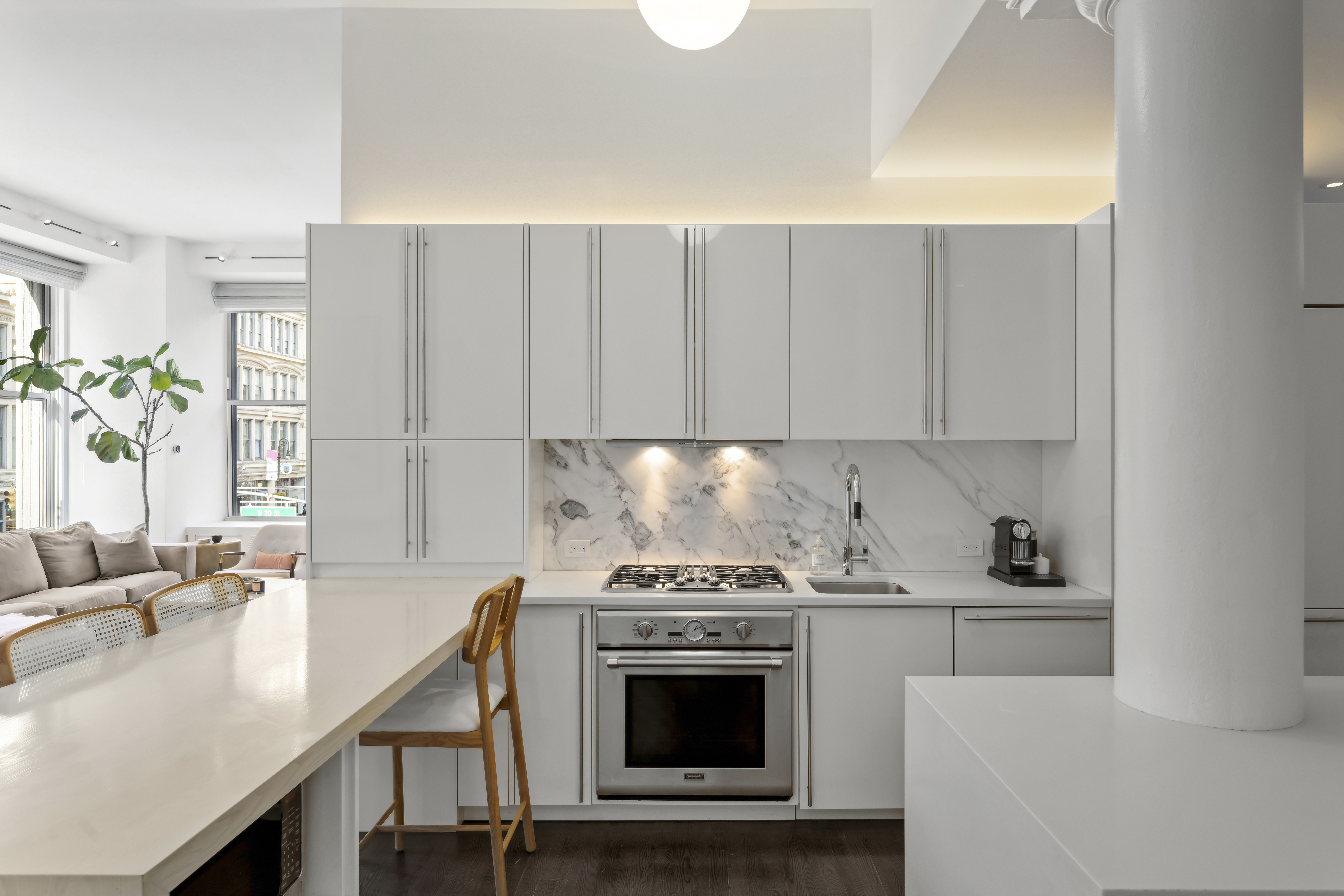 60 West 20th Street, Unit 2F Manhattan, NY 10011 - Photo 7 of 21 a kitchen with a sink cabinets and stainless steel appliances