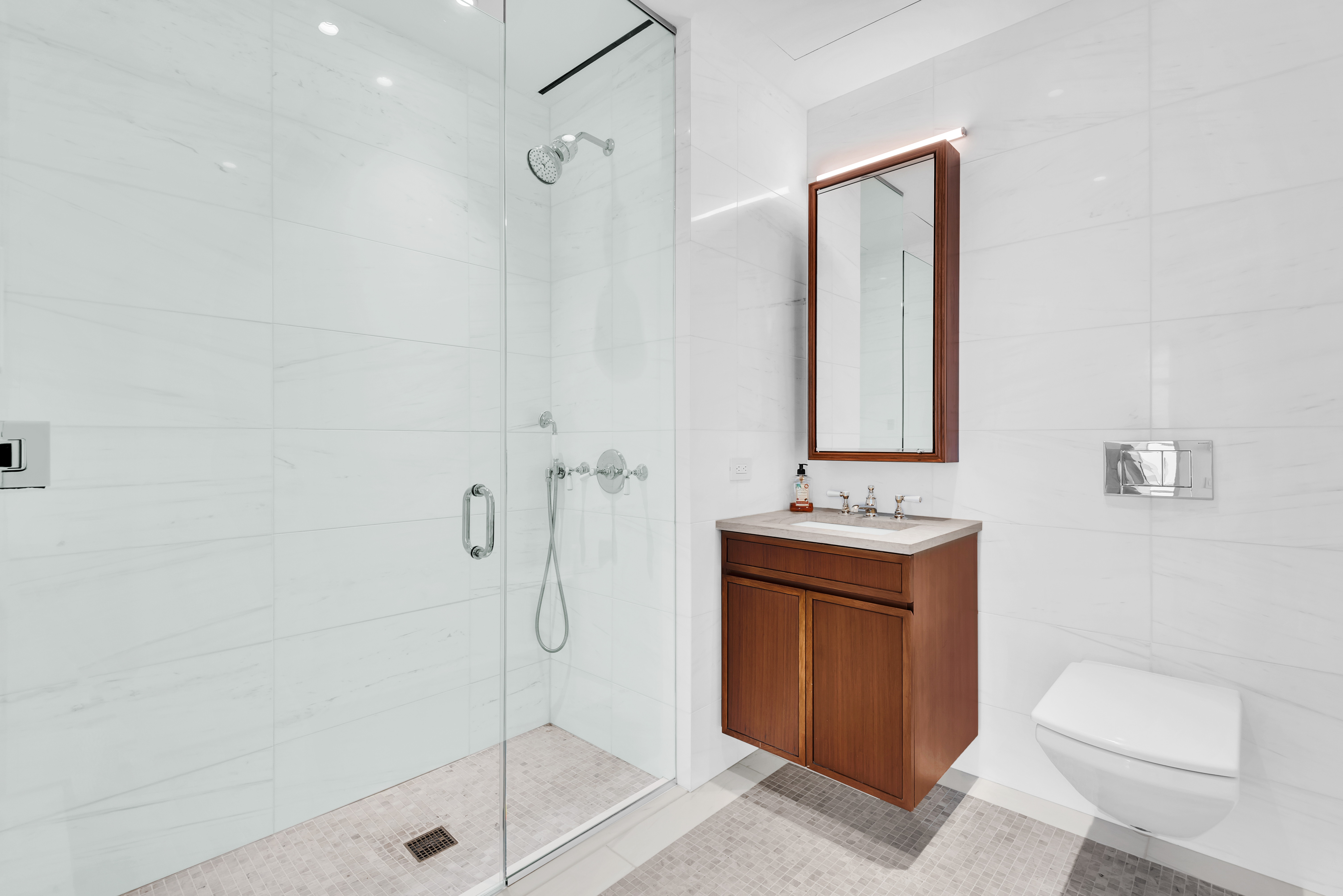 5 Beekman Street, Unit 48B Manhattan, NY 10038 - Photo 8 of 17 a bathroom with a sink a toilet and shower