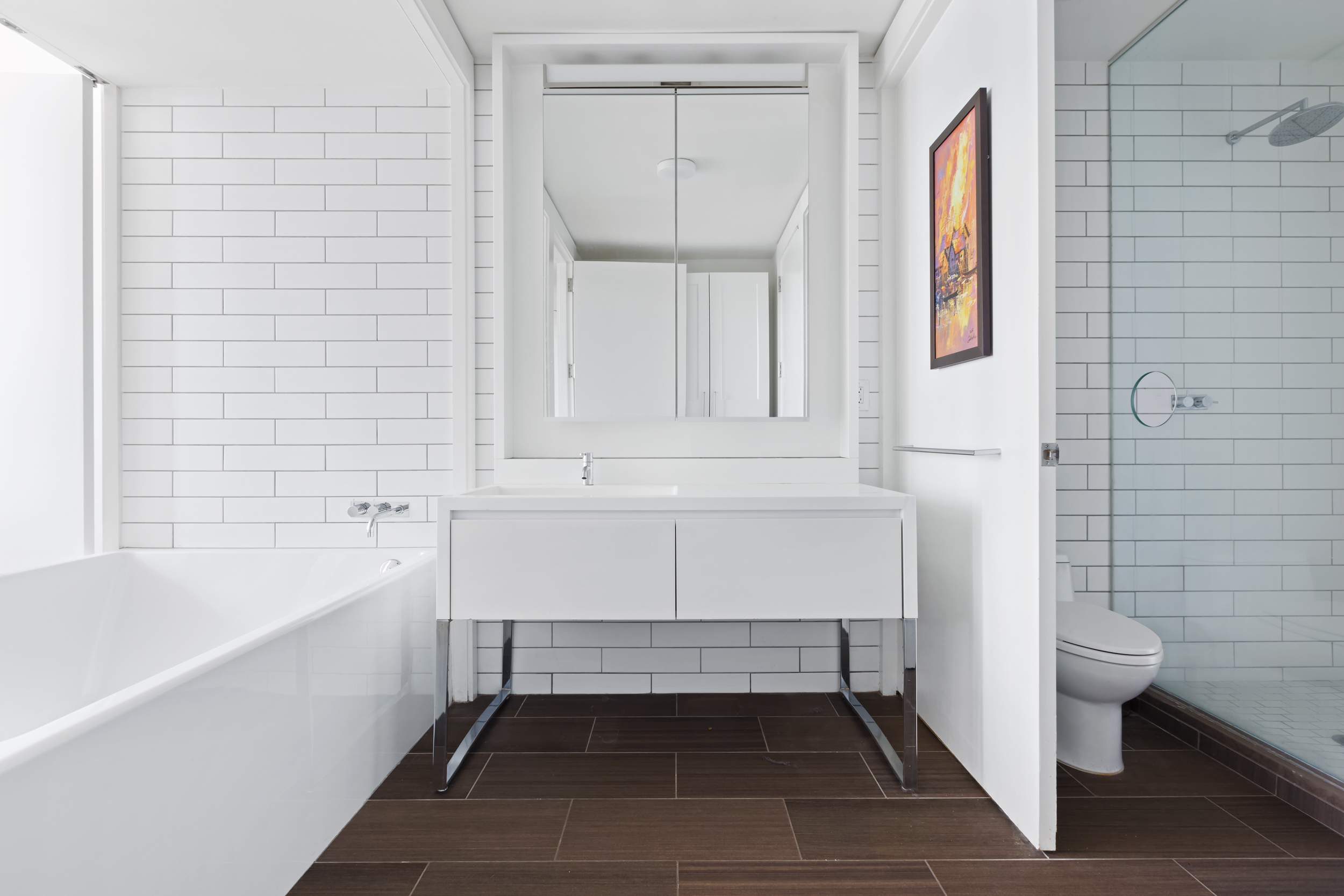 15 William Street, Unit 40C Manhattan, NY 10005 - Photo 6 of 18 a bathroom with a sink and a bathtub