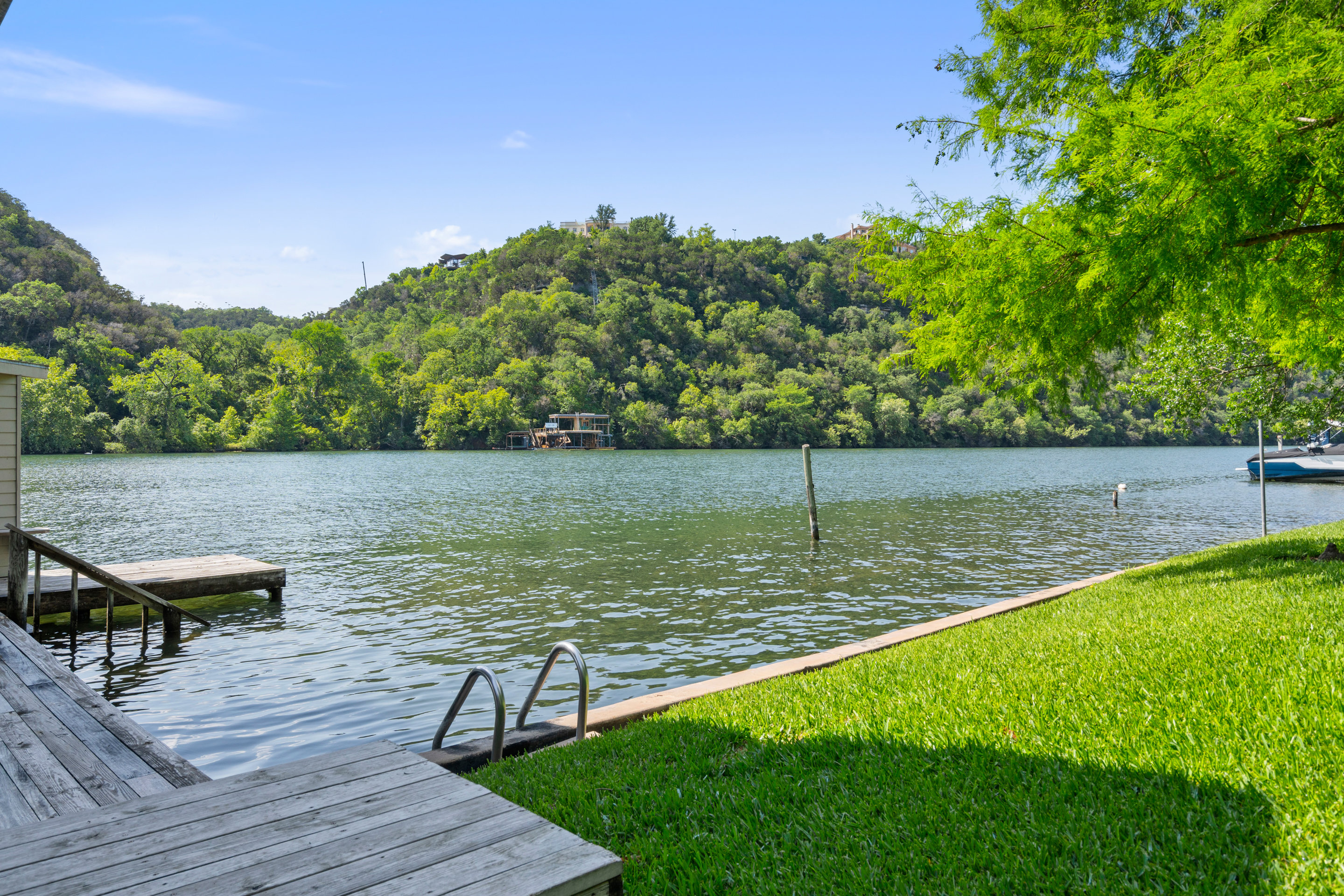 2603 Pearce Road Austin, TX 78730 - Photo 40 of 41 a view of a lake with houses in the back