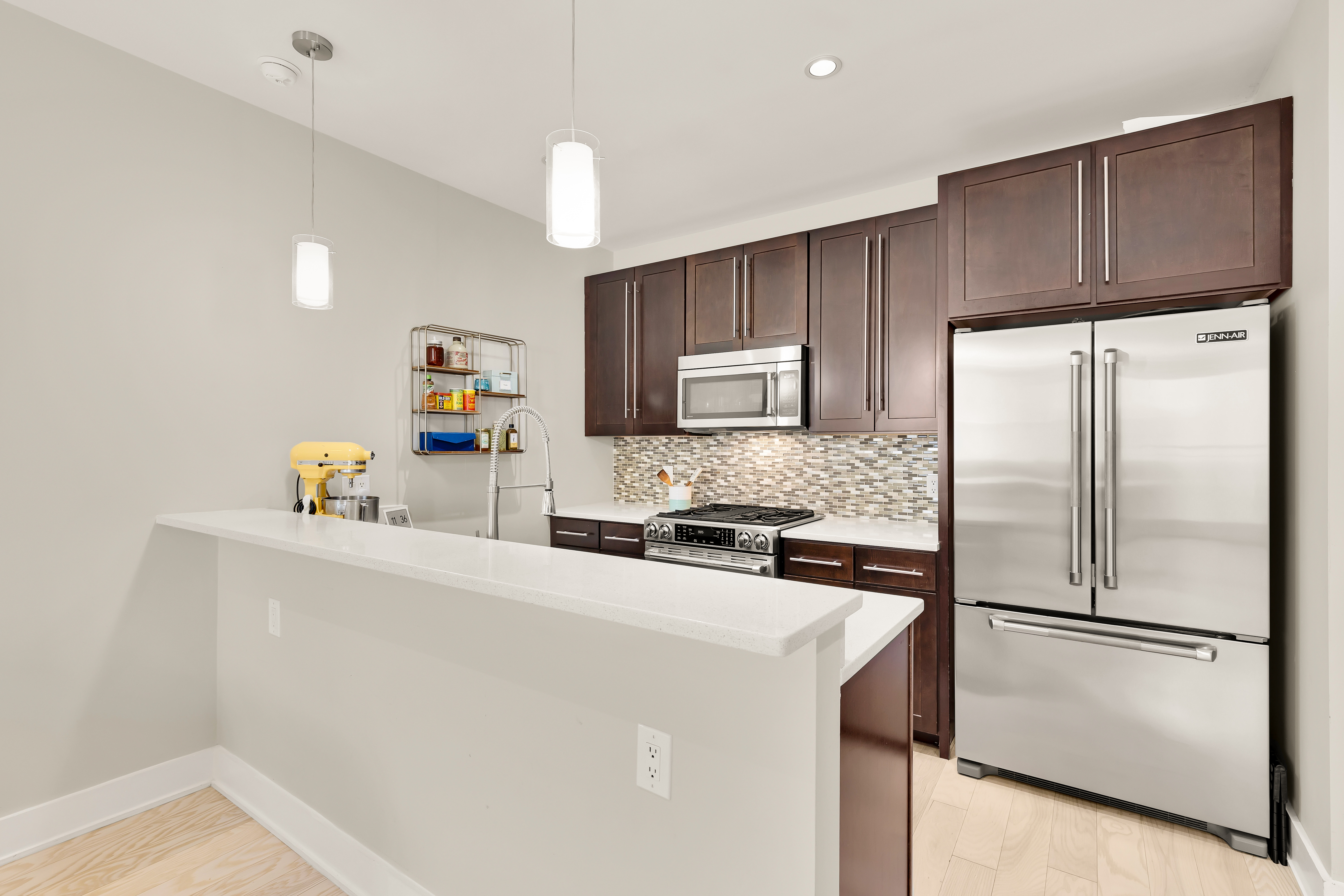 2101 11th Street Northwest, Unit 403 Washington, DC 20001 - Photo 9 of 30 a kitchen with a refrigerator a stove top oven a sink and cabinets