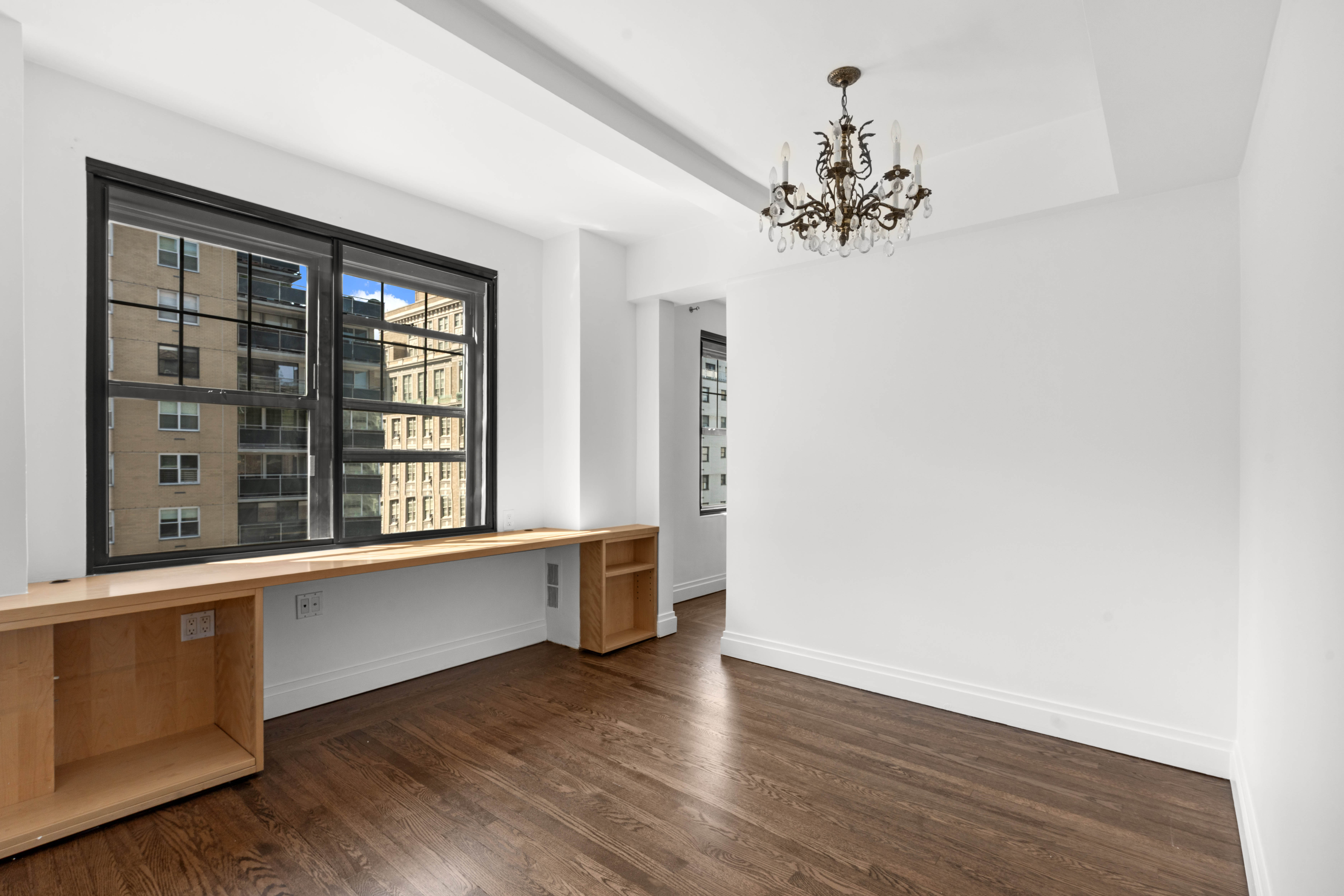 200 East 16th Street, Unit 14K Manhattan, NY 10003 - Photo 5 of 7 wooden floor in an empty room with a window