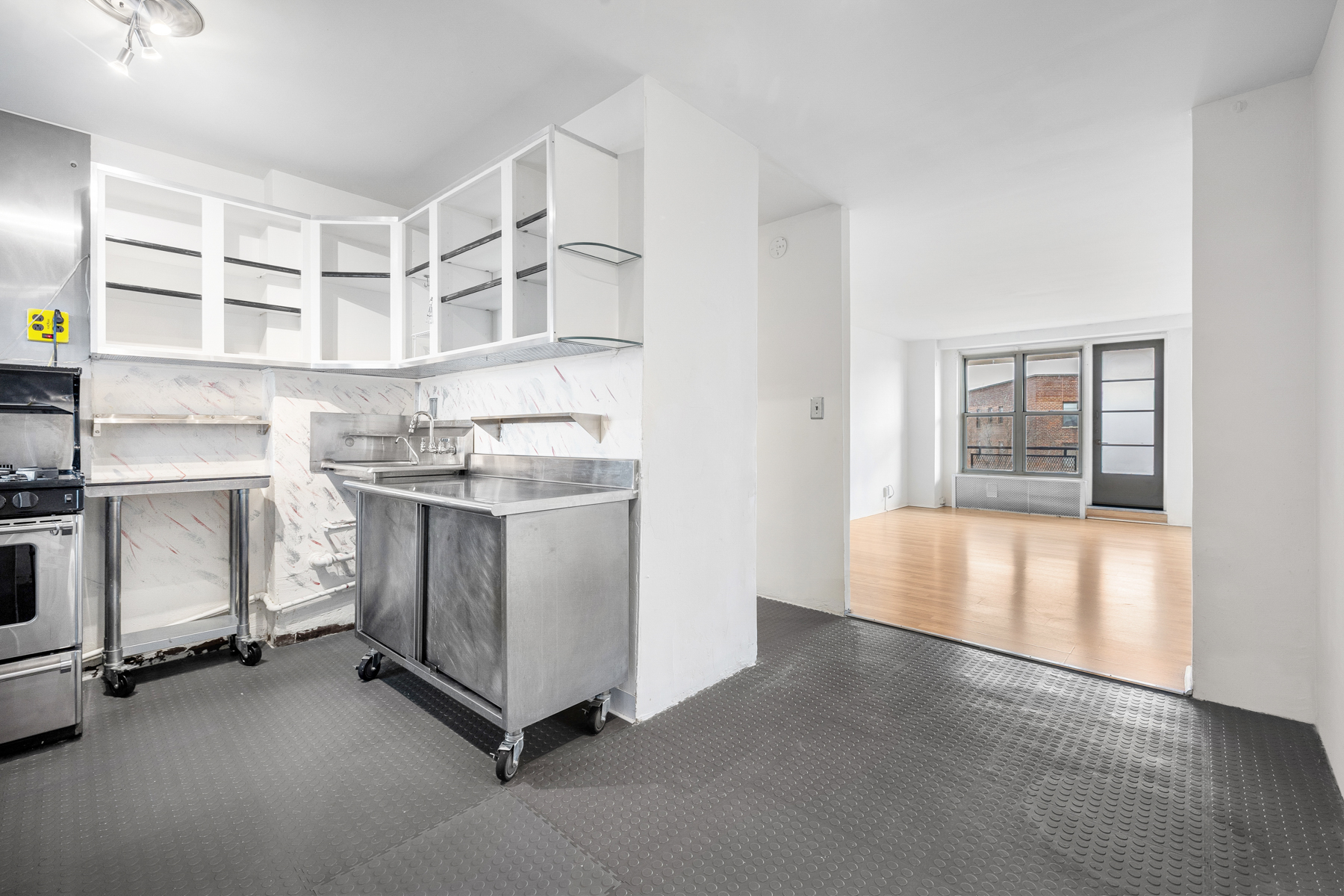 35-50 85th Street, Unit 9J Queens, NY 11372 - Photo 3 of 11 a view of a room with cabinets
