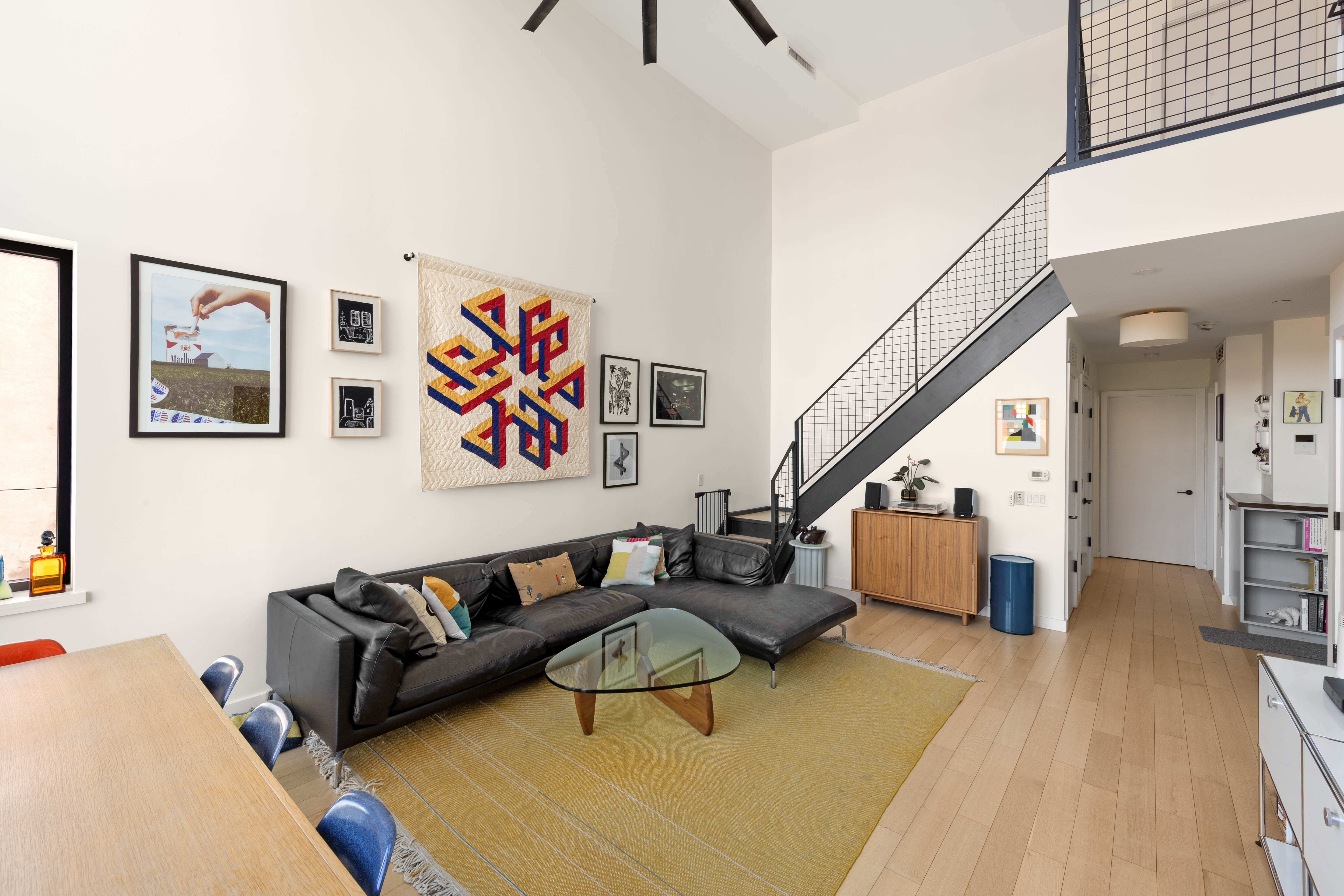 33 Conselyea Street, Unit PH Brooklyn, NY 11211 - Photo 3 of 16 a living room with furniture and wooden floor