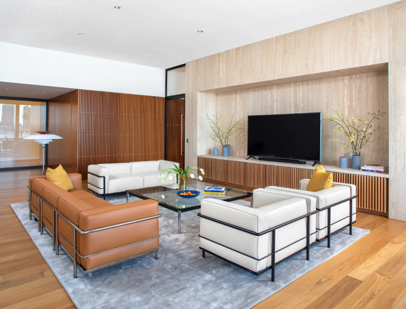 695 1st Avenue, Unit 33B Manhattan, NY 10016 - Photo 17 of 25 a living room with furniture and a flat screen tv