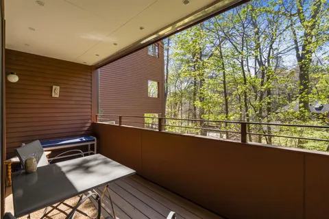 a view of a balcony with chairs